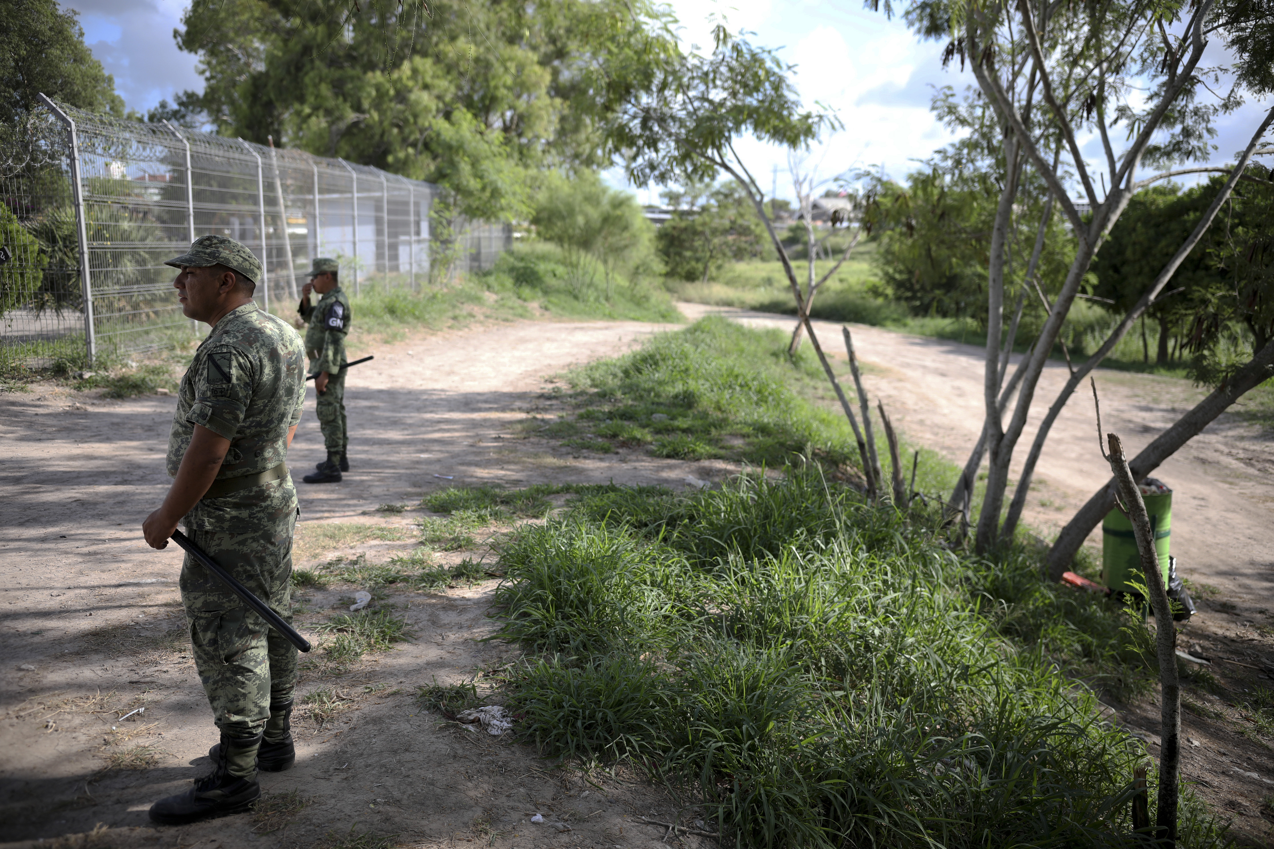 Military police wearing the insignia of the National Guard patrol near the border bridge that crosses the Rio Grande river in Matamoros, Mexico, Thursday, Aug. 1, 2019, on the border with Brownsville, Texas. Migrants are being sent back to wait in this Mexican state of Tamaulipas, a place the U.S. State Department warns Americans to avoid all travel due to high levels of violence and kidnapping, under a plan known colloquially as “remain in Mexico.” (AP Photo/Emilio Espejel)