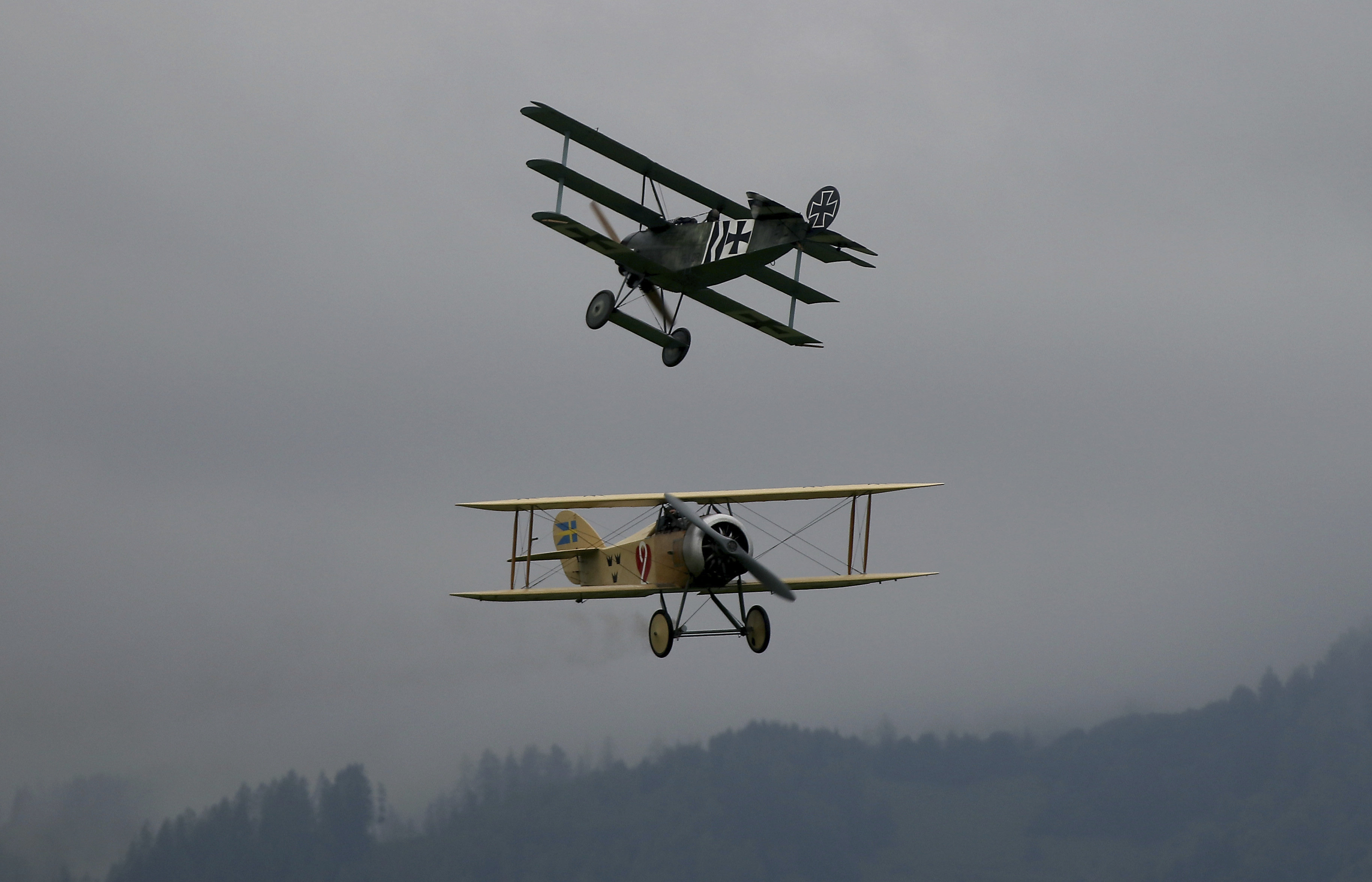 A Fokker DR I, top. and a Tummelisa perform during the Airpower 19 airplane show in Zeltweg, Styria, Austria, Friday, Sept. 6, 2019. (AP Photo/Ronald Zak)