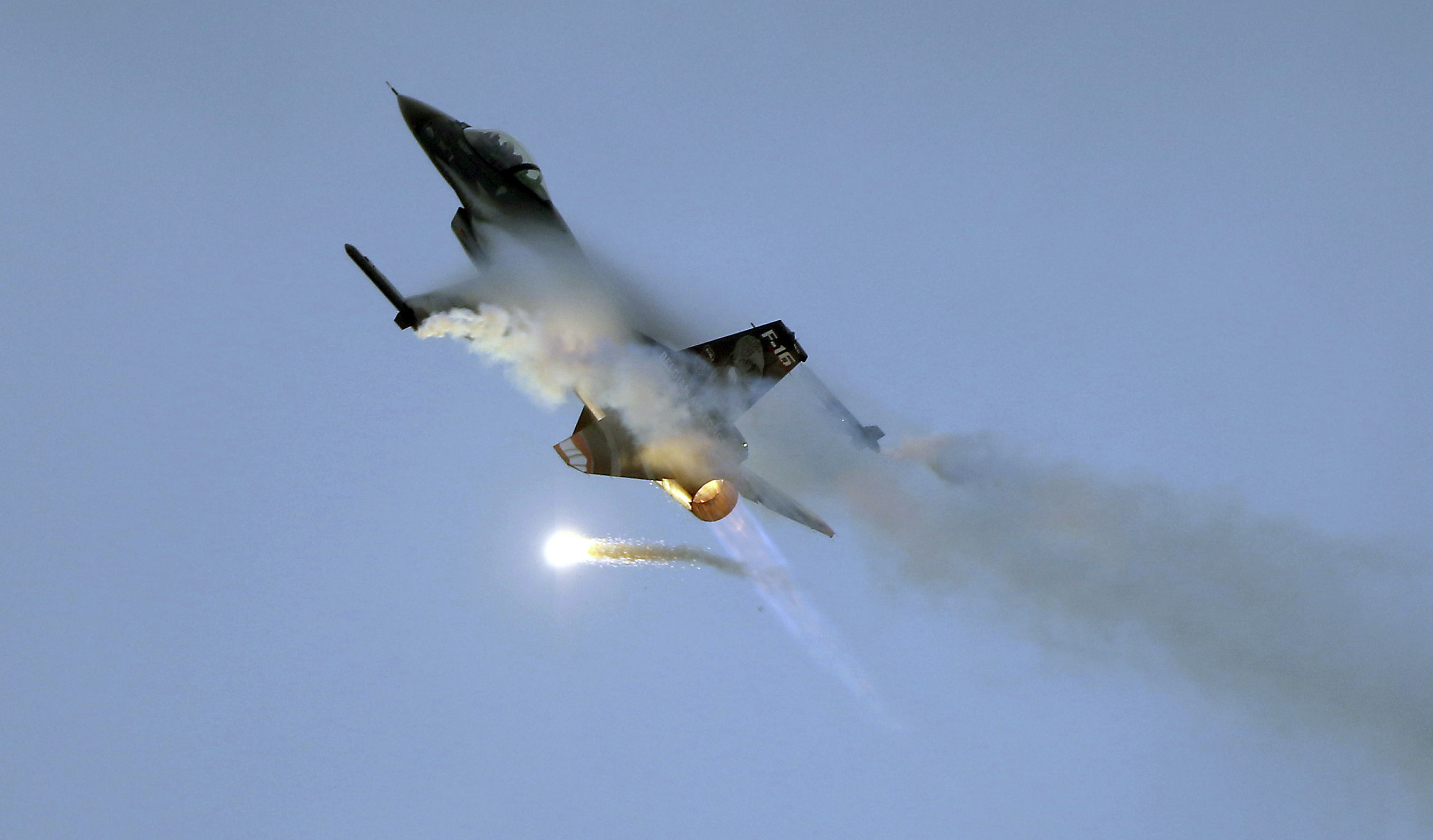 A F-16 Dark Falcon from the Belgian Air Force performs during the Airpower 19 airplane show in Zeltweg, Austria, Friday, Sept. 6, 2019. (AP Photo/Ronald Zak)