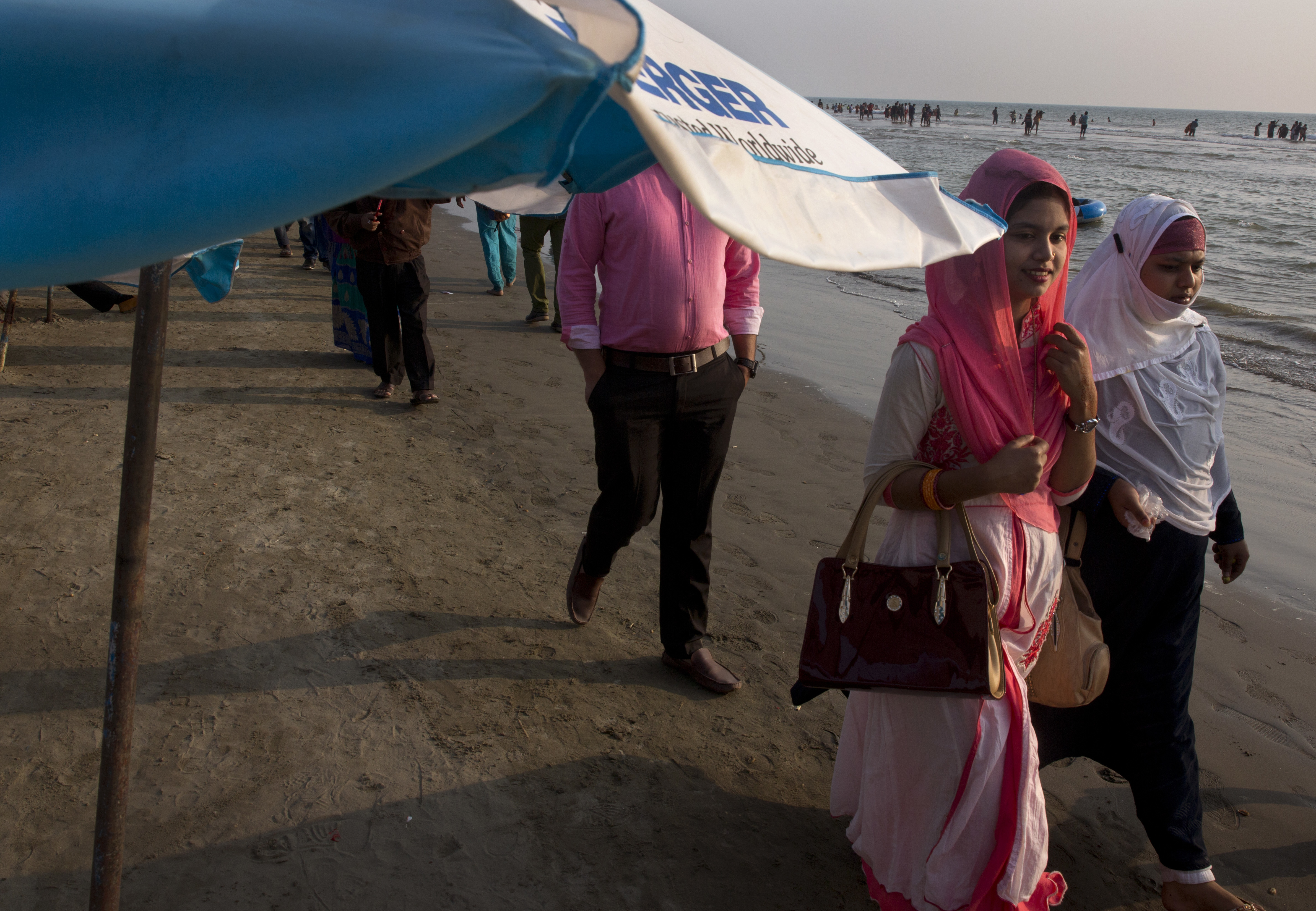 Bangladeshi enjoy weekly off at a beach in Cox's Bazar, Bangladesh Friday, Jan. 26, 2018. Miles-long beaches makes this coastal district Bangladesh's top tourist destination. (AP Photo/Manish Swarup)