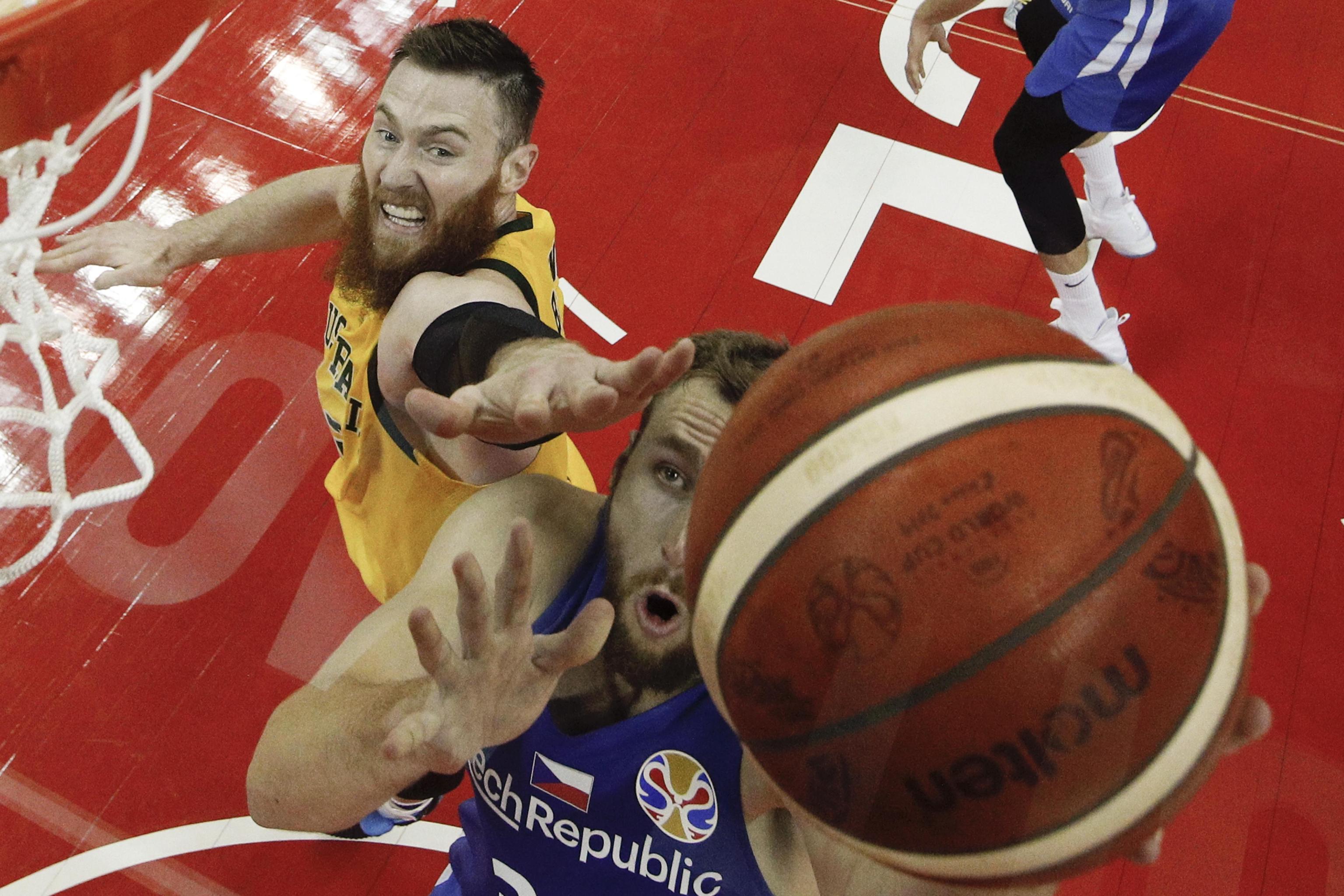 epa07835801 Martin Kriz of Czech Republic goes for a shot over Nathan Sobey of Australia during their quarterfinals match for the FIBA Basketball World Cup at the Shanghai Oriental Sports Center in Shanghai, China, 11 September 2019.  EPA/ANDY WONG / POOL