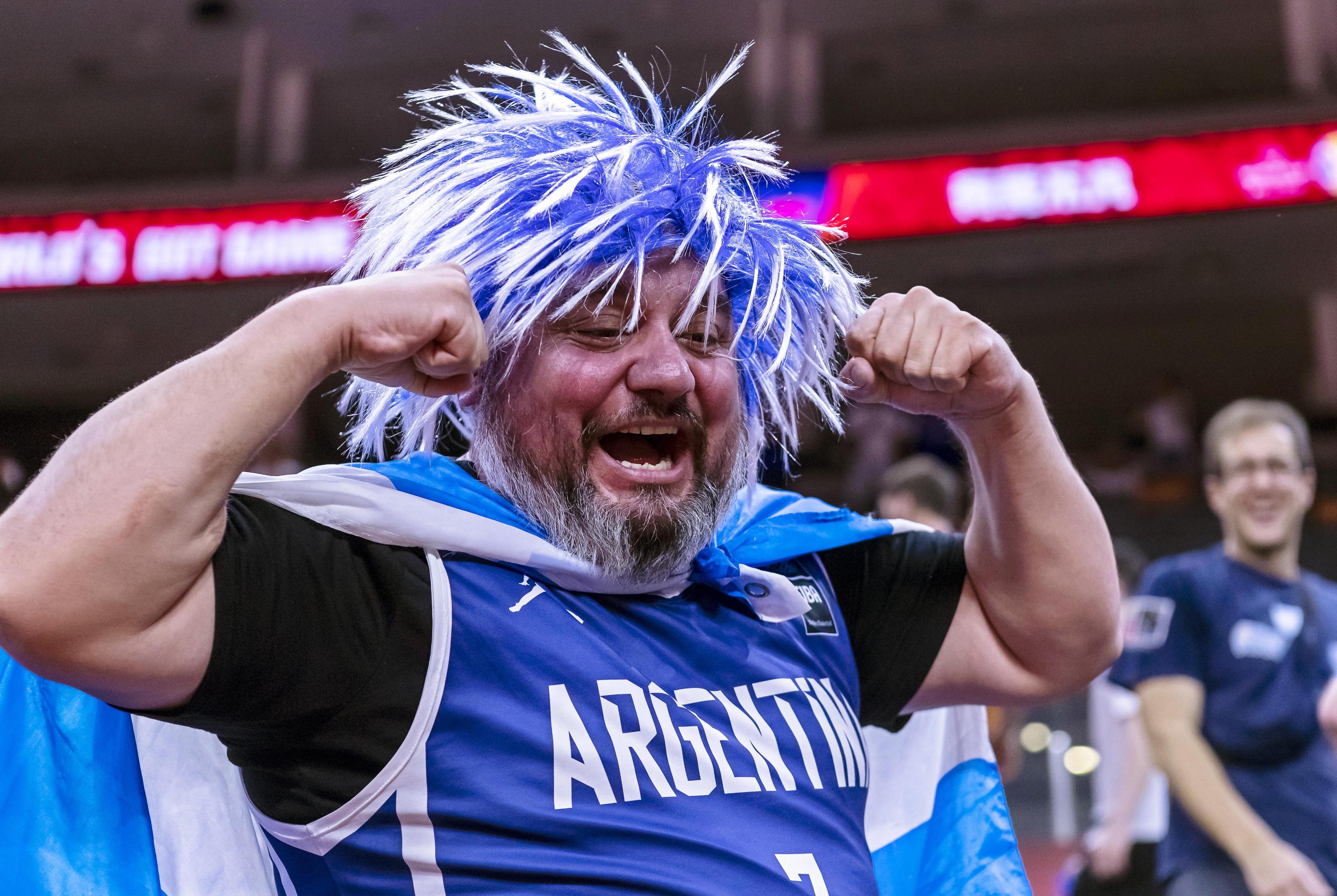 epa07832522 A supporter of Argentina celebrates after his team won the FIBA Basketball World Cup 2019 quarter final match between Argentina and Serbia in Dongguan, China, 10 September 2019.  EPA/ALEX PLAVEVSKI