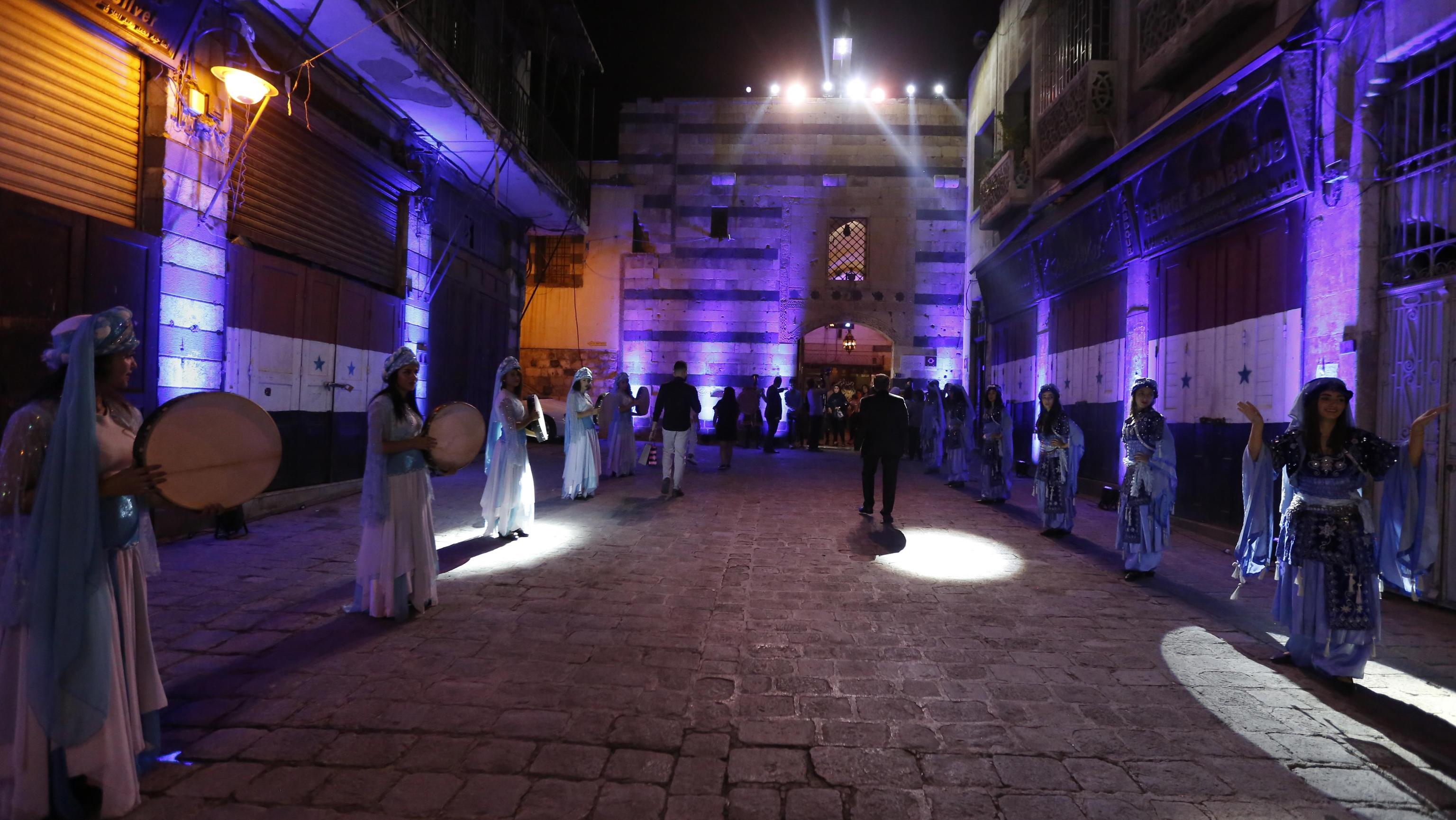 epa07840830 Singers from Arab and European countries participate in a concert held at the historical Azm Palace in the old city of Damascus, Syria, 13 August 2019. The concert, titled 'the journey of al-Mowashah (a kind of poetic singing dates back to the 9th century) from Andalusia to al-Sham'. The event is organised by the Syrian ministries of culture and tourism with the cooperation of Ein al-Fonoun Association.  EPA/YOUSSEF BADAWI