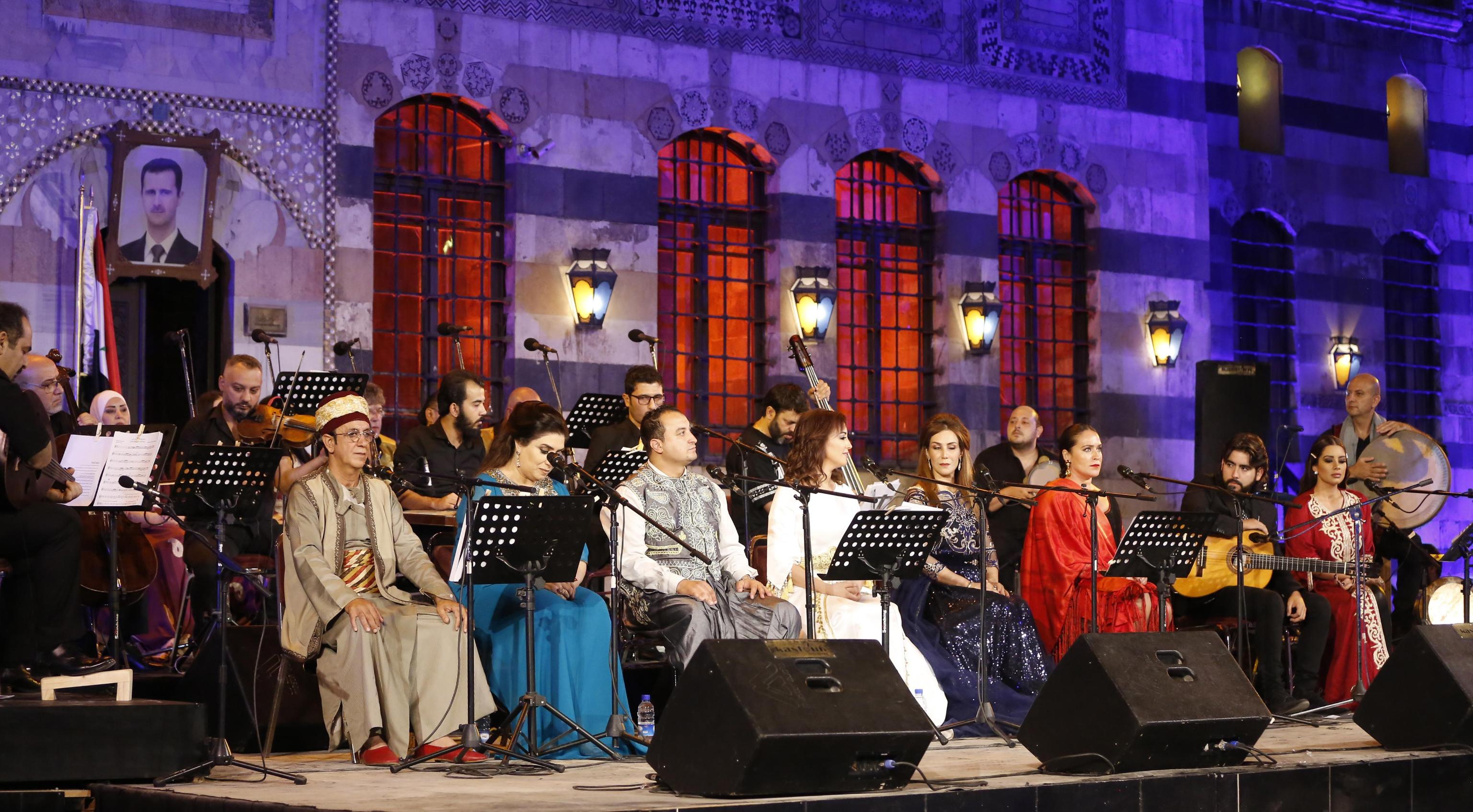 epa07840825 Singers from Arab and European countries participate in a concert held at the historical Azm Palace in the old city of Damascus, Syria, 13 August 2019. The concert, titled 'the journey of al-Mowashah (a kind of poetic singing dates back to the 9th century) from Andalusia to al-Sham'. The event is organised by the Syrian ministries of culture and tourism with the cooperation of Ein al-Fonoun Association.  EPA/YOUSSEF BADAWI