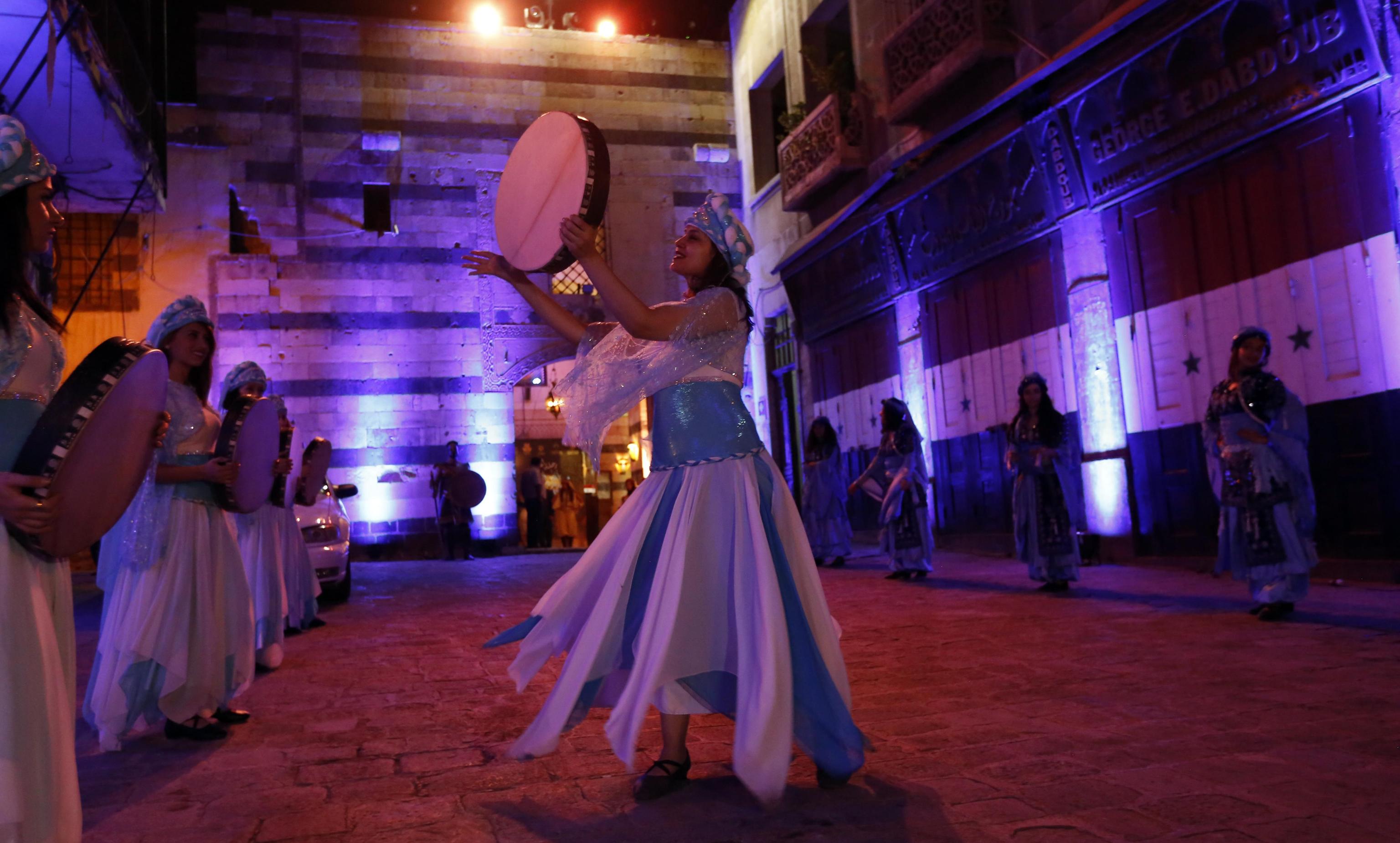 epa07840827 Singers from Arab and European countries participate in a concert held at the historical Azm Palace in the old city of Damascus, Syria, 13 August 2019. The concert, titled 'the journey of al-Mowashah (a kind of poetic singing dates back to the 9th century) from Andalusia to al-Sham'. The event is organised by the Syrian ministries of culture and tourism with the cooperation of Ein al-Fonoun Association.  EPA/YOUSSEF BADAWI