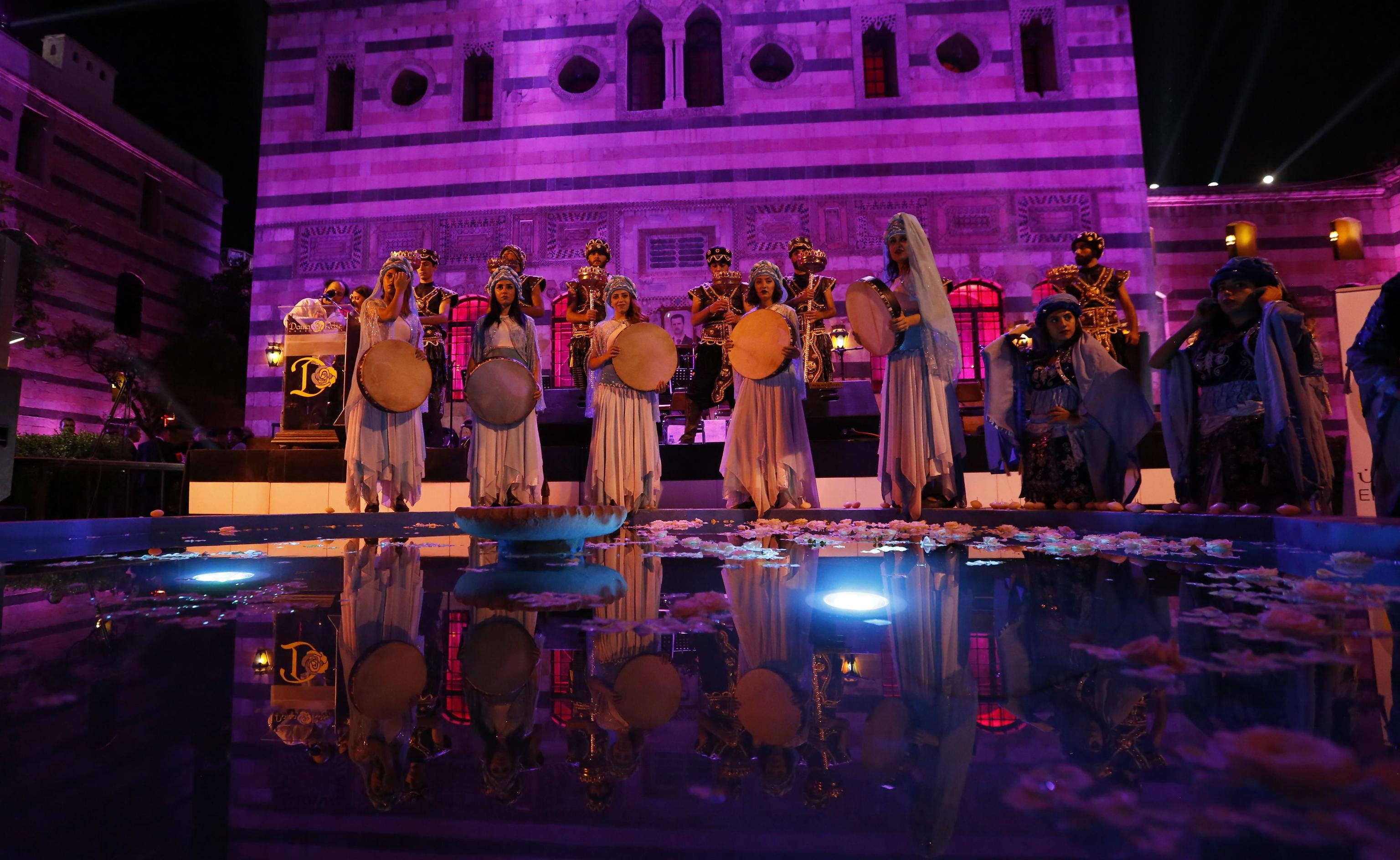 epa07840829 Singers from Arab and European countries participate in a concert held at the historical Azm Palace in the old city of Damascus, Syria, 13 August 2019. The concert, titled 'the journey of al-Mowashah (a kind of poetic singing dates back to the 9th century) from Andalusia to al-Sham'. The event is organised by the Syrian ministries of culture and tourism with the cooperation of Ein al-Fonoun Association.  EPA/YOUSSEF BADAWI