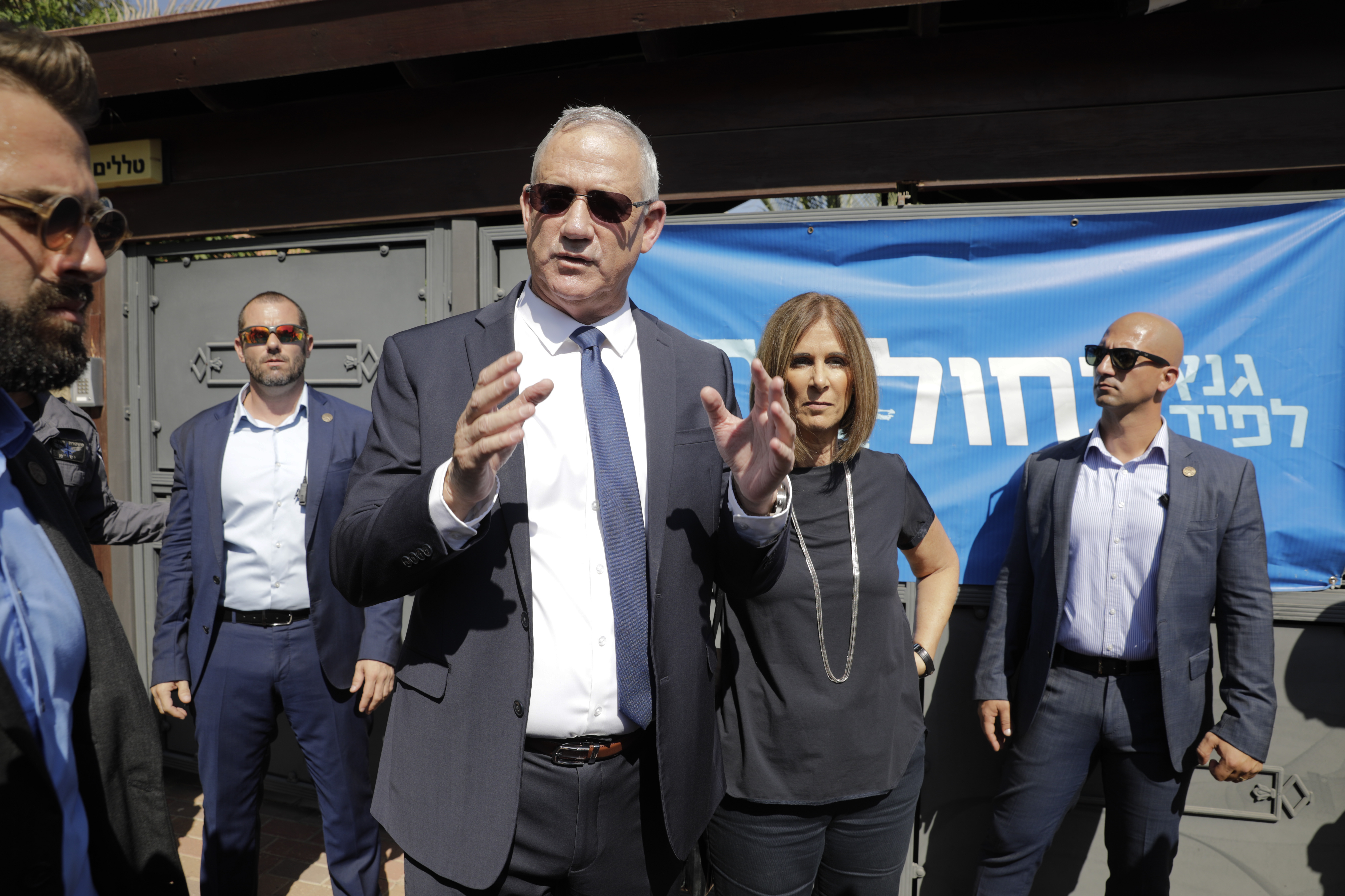 Blue and White party leader Benny Gantz speaks after he cats his ballot in Rosh Haayin, Israel, Tuesday, Sept. 17, 2019. Israelis began voting Tuesday in an unprecedented repeat election that will decide whether longtime Prime Minister Benjamin Netanyahu stays in power despite a looming indictment on corruption charges. (AP Photo/Sebastian Scheiner)