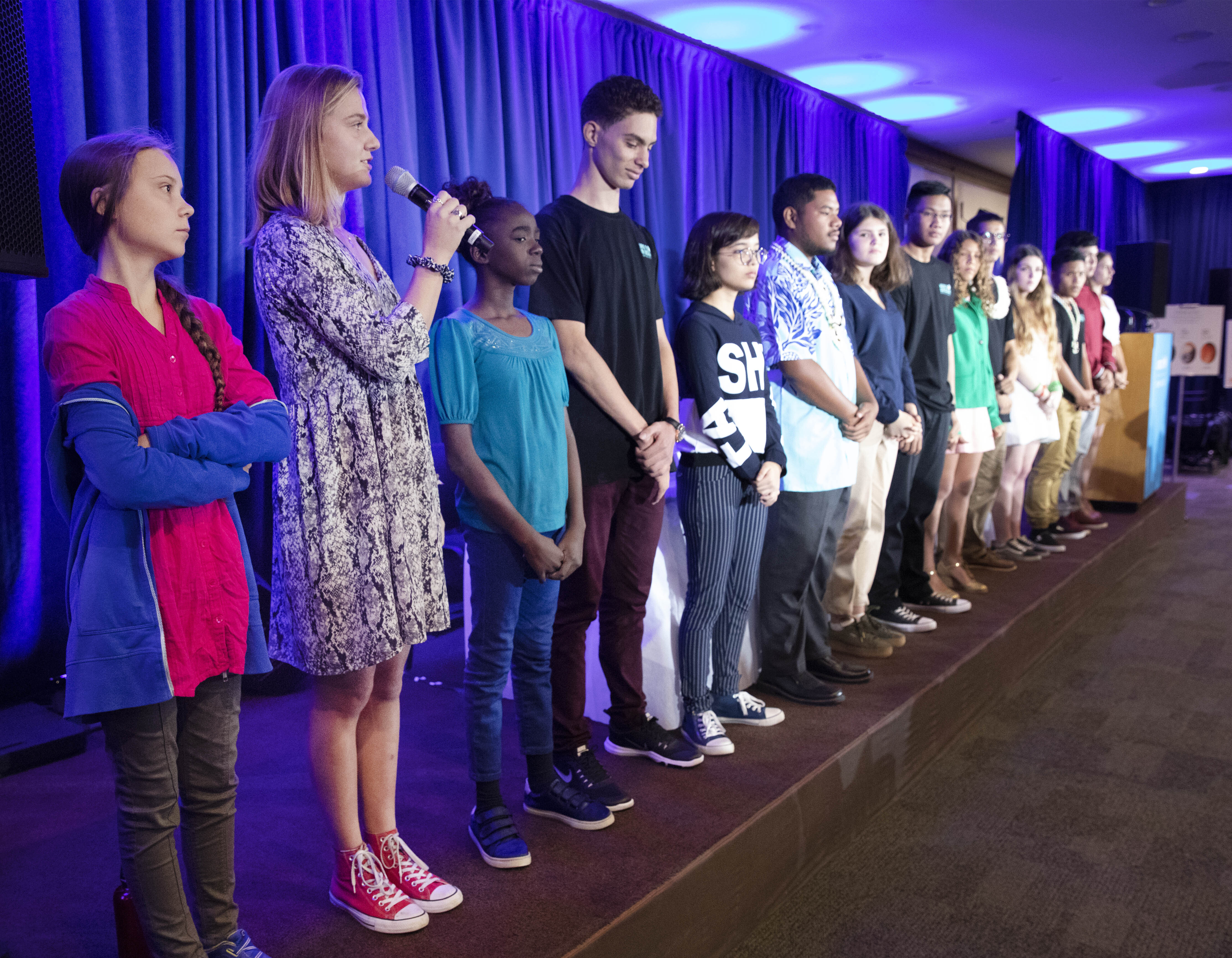 Iris Duquesne of France, second from left, is joined by other child petitioners to announce a complaint they will file before the United Nations Committee on the Rights of the Child to protest lack of government action on the climate crisis, Monday, Sept. 23, 2019 in New York. Greta Thunberg is on the left. (AP Photo/Mark Lennihan)