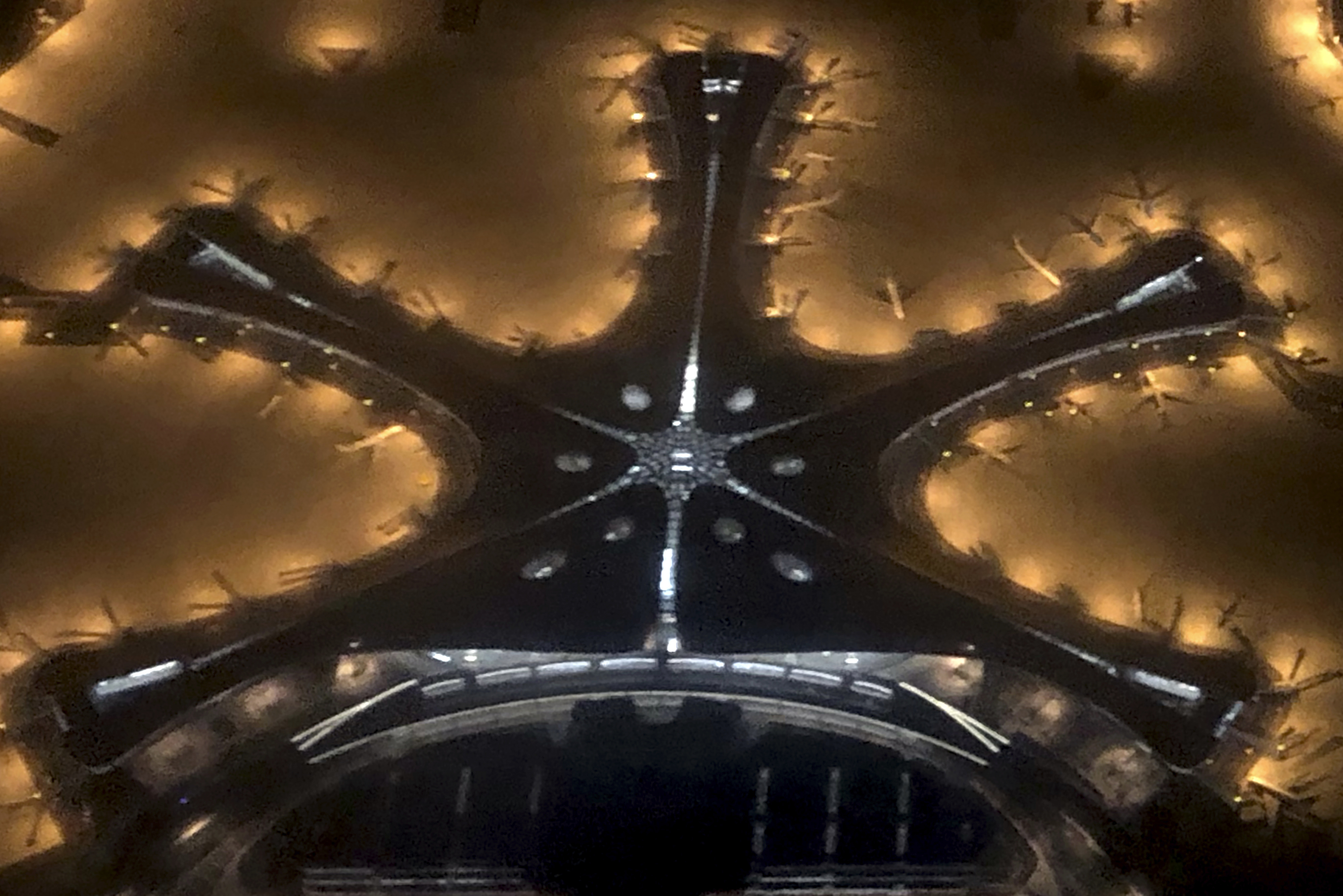 In this Tuesday, Sept. 24, 2019, photo, the terminal building for the new Beijing Daxing International Airport is seen from above in an aerial view in Beijing. Chinese President Xi Jinping presided Wednesday over the inauguration of a second international airport for Beijing with a terminal billed as the world's biggest. (AP Photo/Mark Schiefelbein)