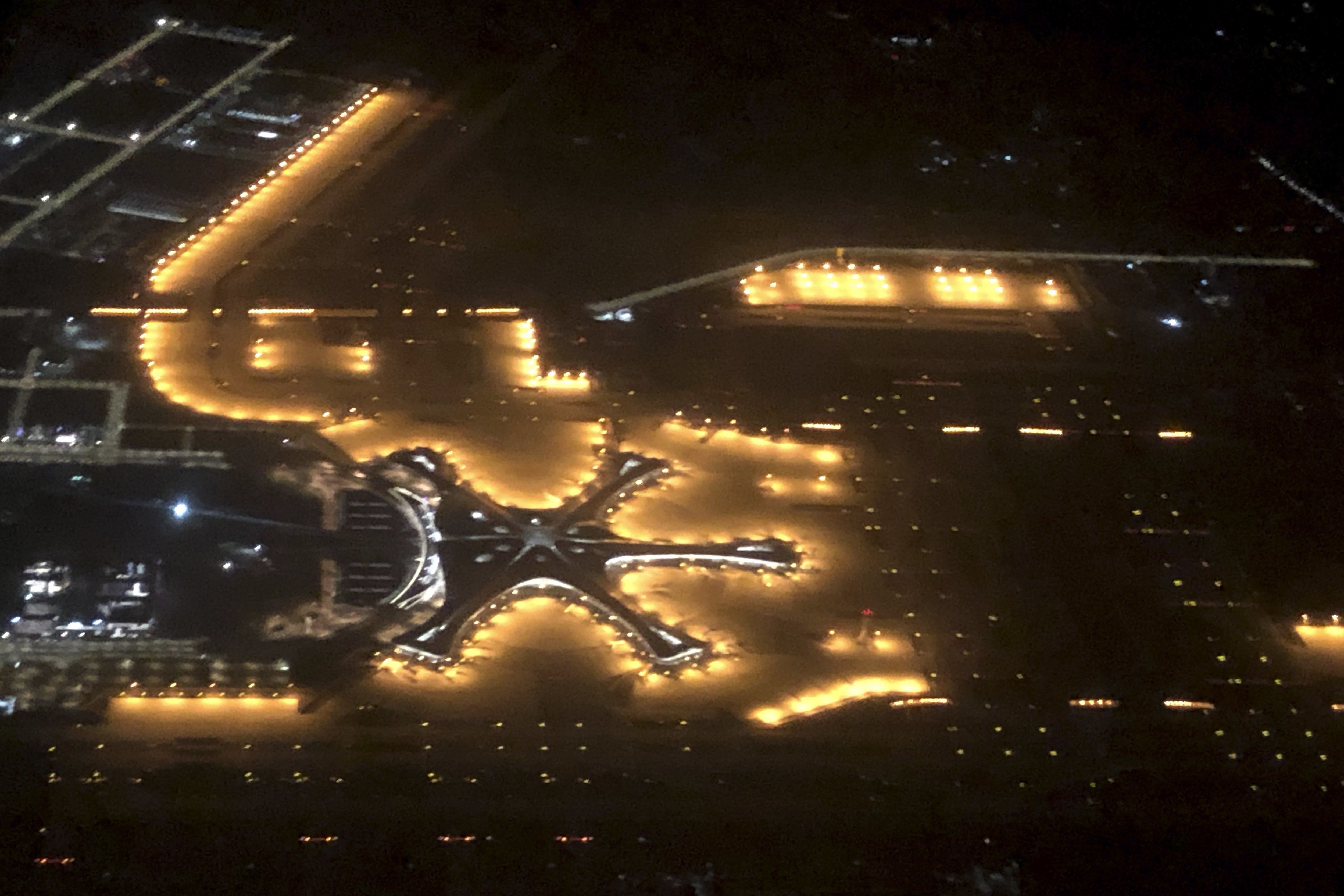 In this Tuesday, Sept. 24, 2019, photo, the new Beijing Daxing International Airport is seen from above in an aerial view in Beijing. Chinese President Xi Jinping presided Wednesday over the inauguration of a second international airport for Beijing with a terminal billed as the world's biggest. (AP Photo/Mark Schiefelbein)