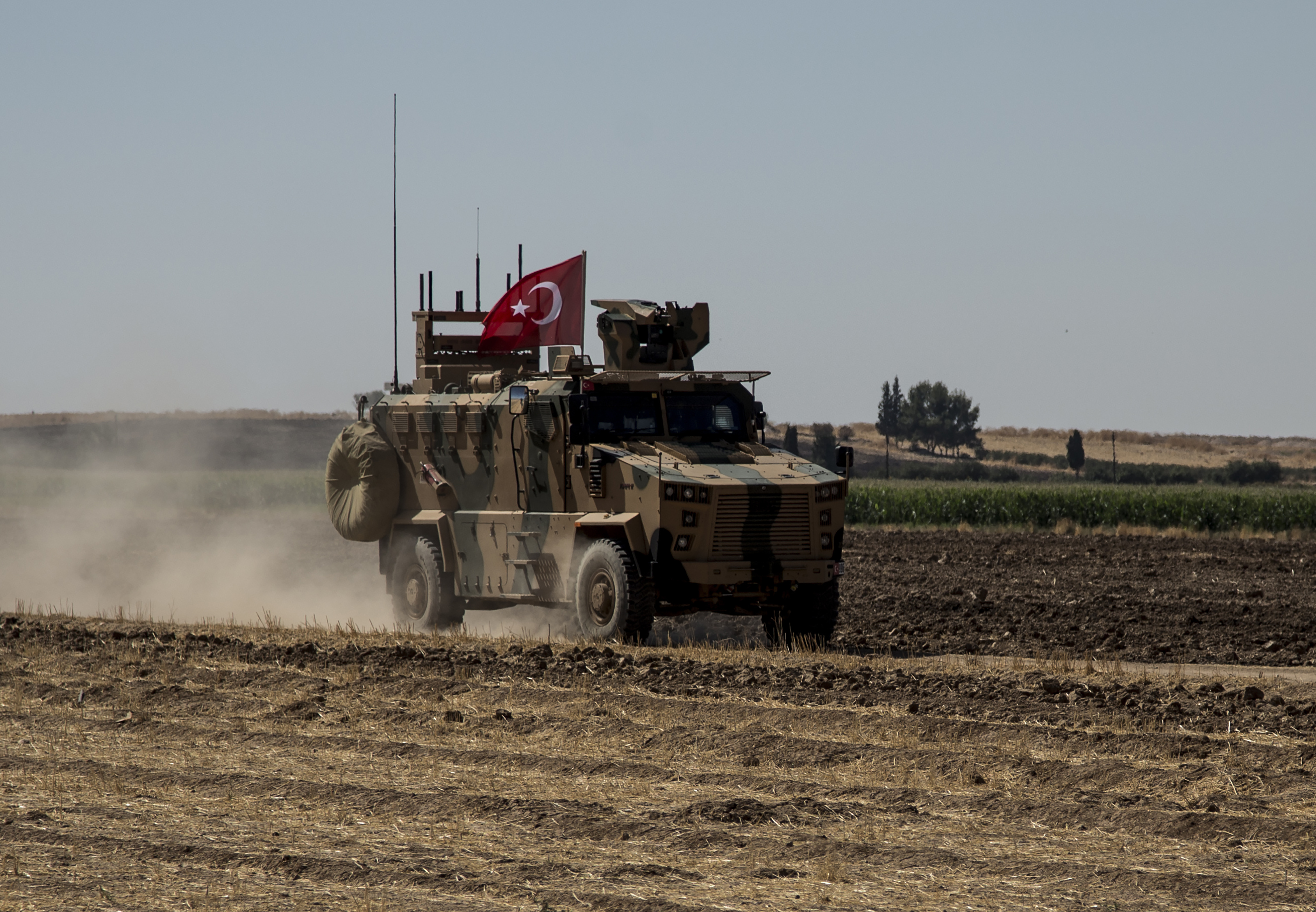 A Turkish armored vehicle patrols with American forces, as they conduct their second joint ground patrol in the so-called 