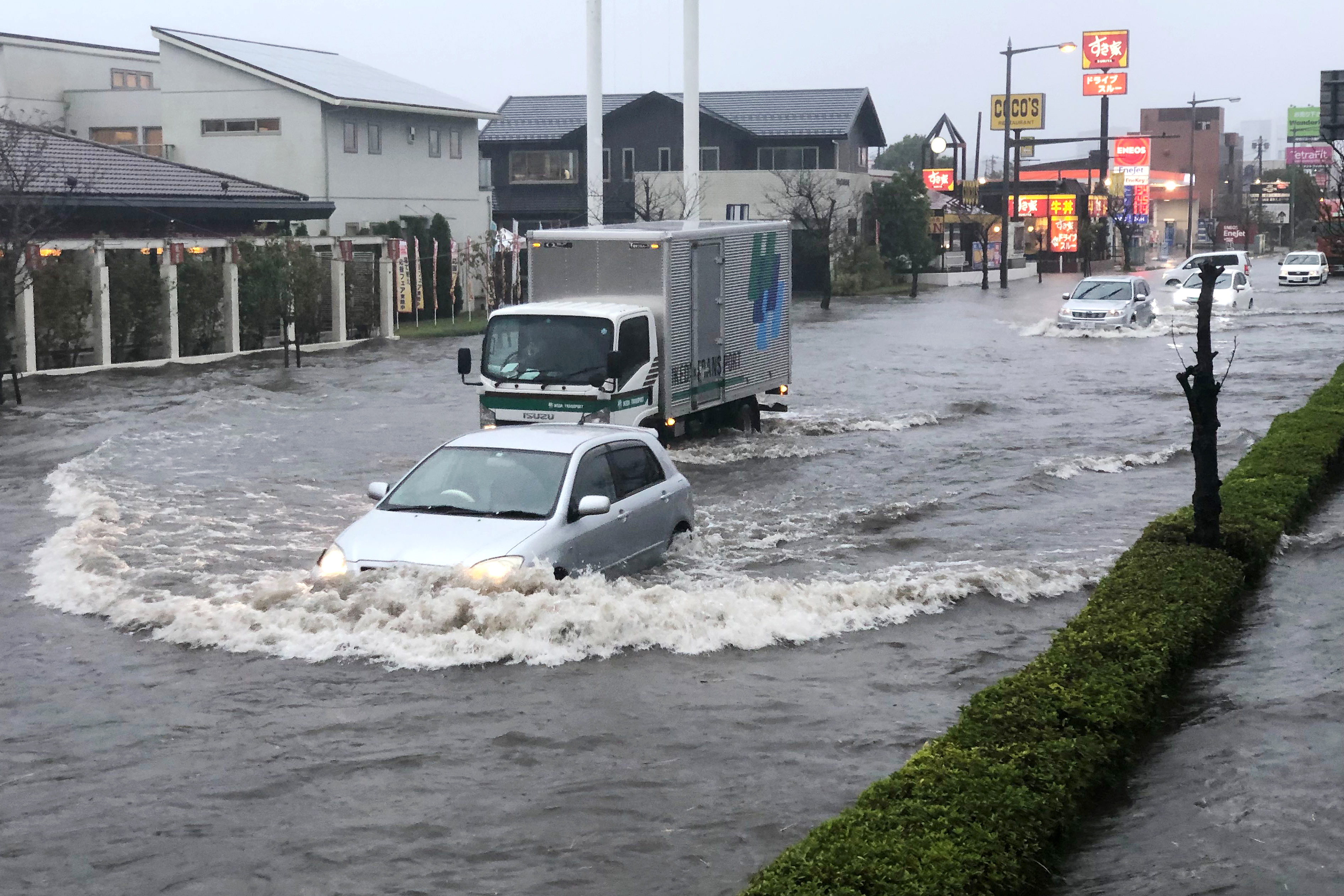 A street is flooded by heavy rain Friday, Oct. 25, 2019, in Narita, east of Tokyo. Torrential rain dumped from a low-pressure system hovering above Japan's main island has triggered flooding in towns east of Tokyo, prompting fears of more damage to areas already hit by typhoons earlier this month. (AP Photo/Lee Jin-man)
