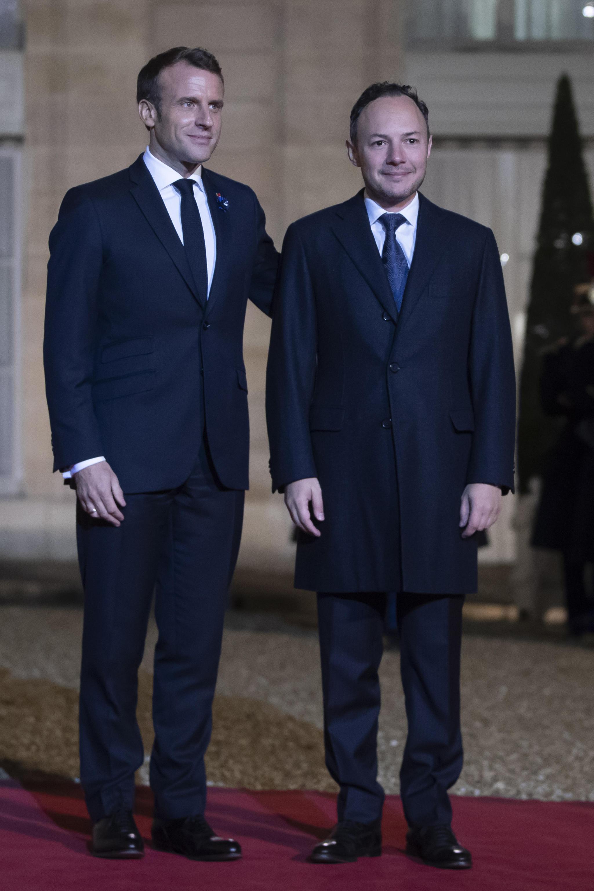 epa07989919 French President Emmanuel Macron (L) welcomes Andorra's Prime Minister Xavier Espot Zamora (R) for a dinner held with participants of the Paris Peace Forum, at the Elysee Palace in Paris, France, 11 November 2019 (issued 12 November 2019).  EPA/CHRISTOPHE PETIT TESSON