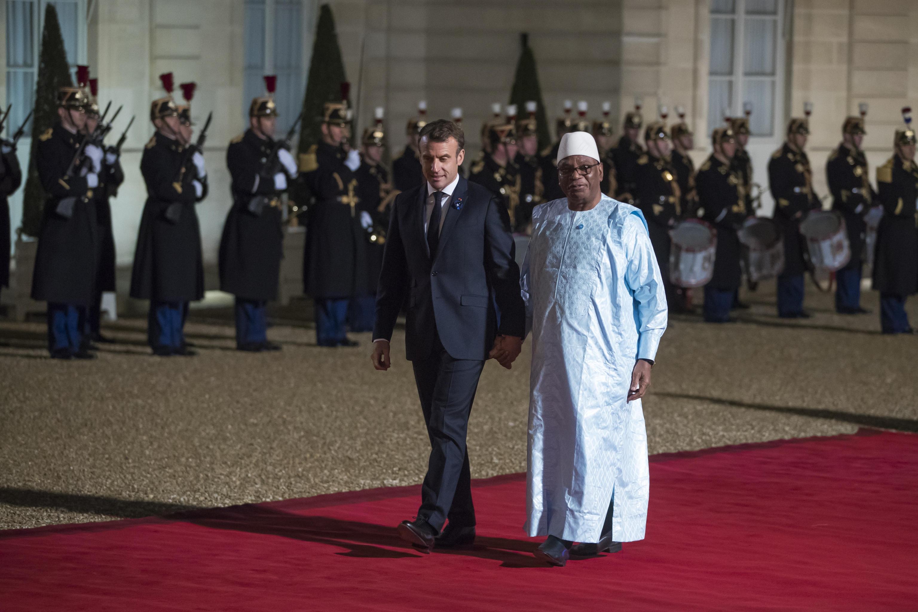 epa07989442 French President Emmanuel Macron (L) welcomes Mali President Ibrahim Boubacar Keita (R) for a dinner held with participants of the Paris Peace Forum, at the Elysee Palace, in Paris, France, 11 November 2019.  EPA/CHRISTOPHE PETIT TESSON