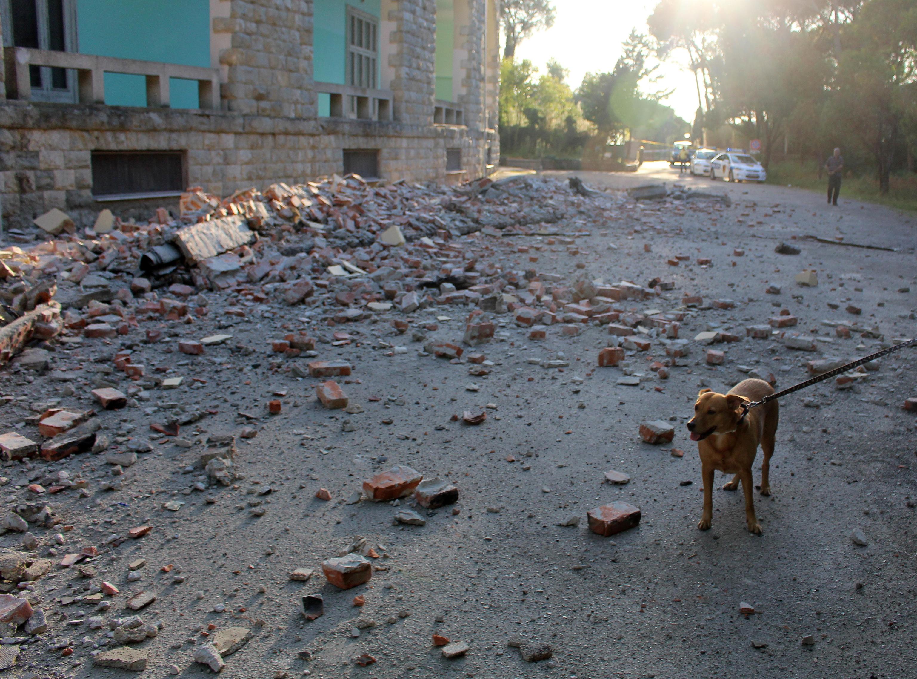 epa07859923 Bricks debris litter the groung of a building of the University of Geology and Mine damaged after a 5.8 magnitude earthquake hit in Tirana, Albania, 21 September 2019. According to reports, Albania was rocked by its strongest earthquake in 30 years, with the epicentre in the coastal town of Durres, at least 49 people have been reported injured from the earthquake.  EPA/MALTON DIBRA