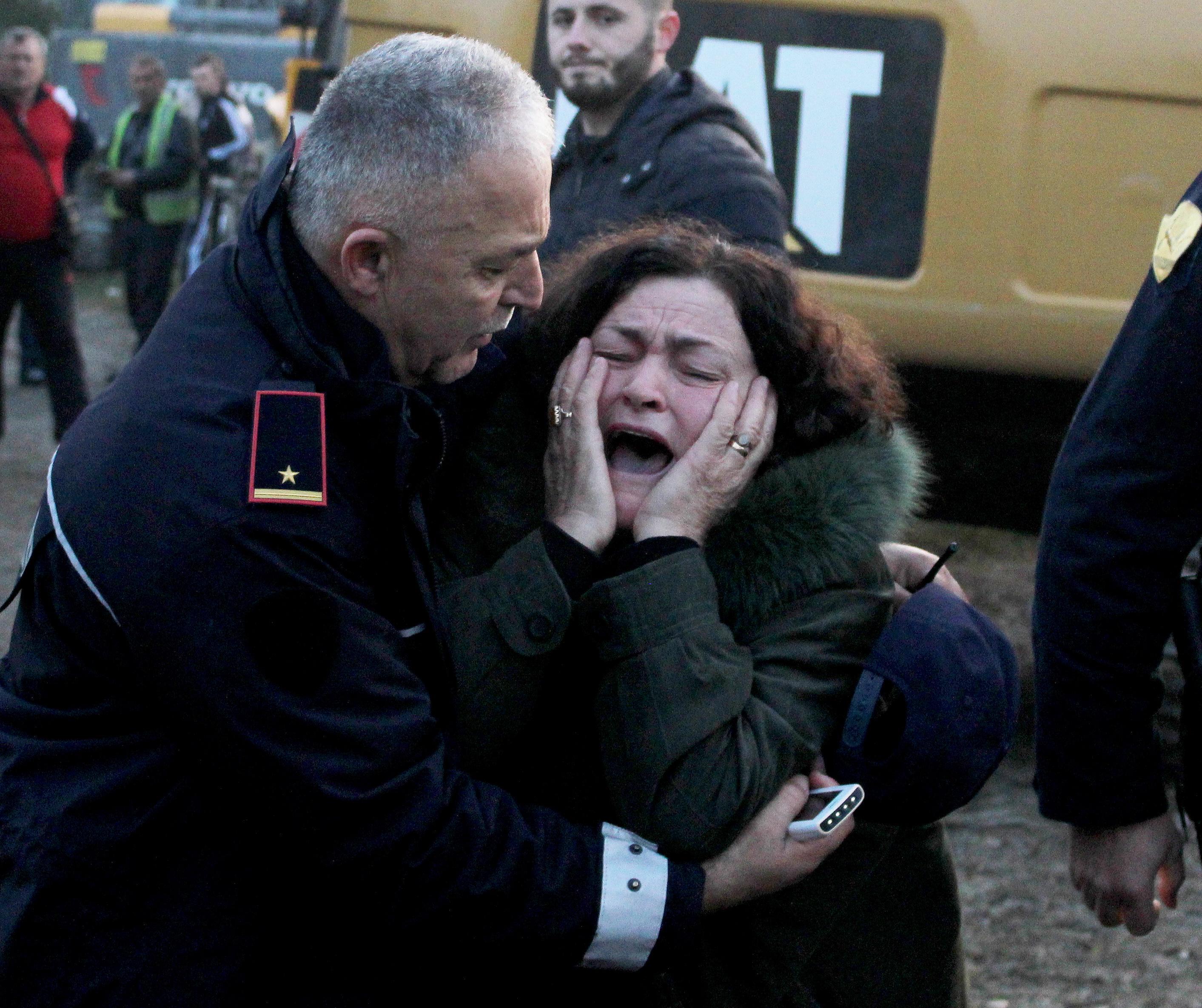 epa08025913 A woman cries as her relatives are trapped in a building after an earthquake hit Thumane, Albania, 25 November 2019. Albania was hit by a 6.4 magnitude earthquake on 26 November 2019, leaving three people dead and dozens injured.  EPA/MALTON DIBRA