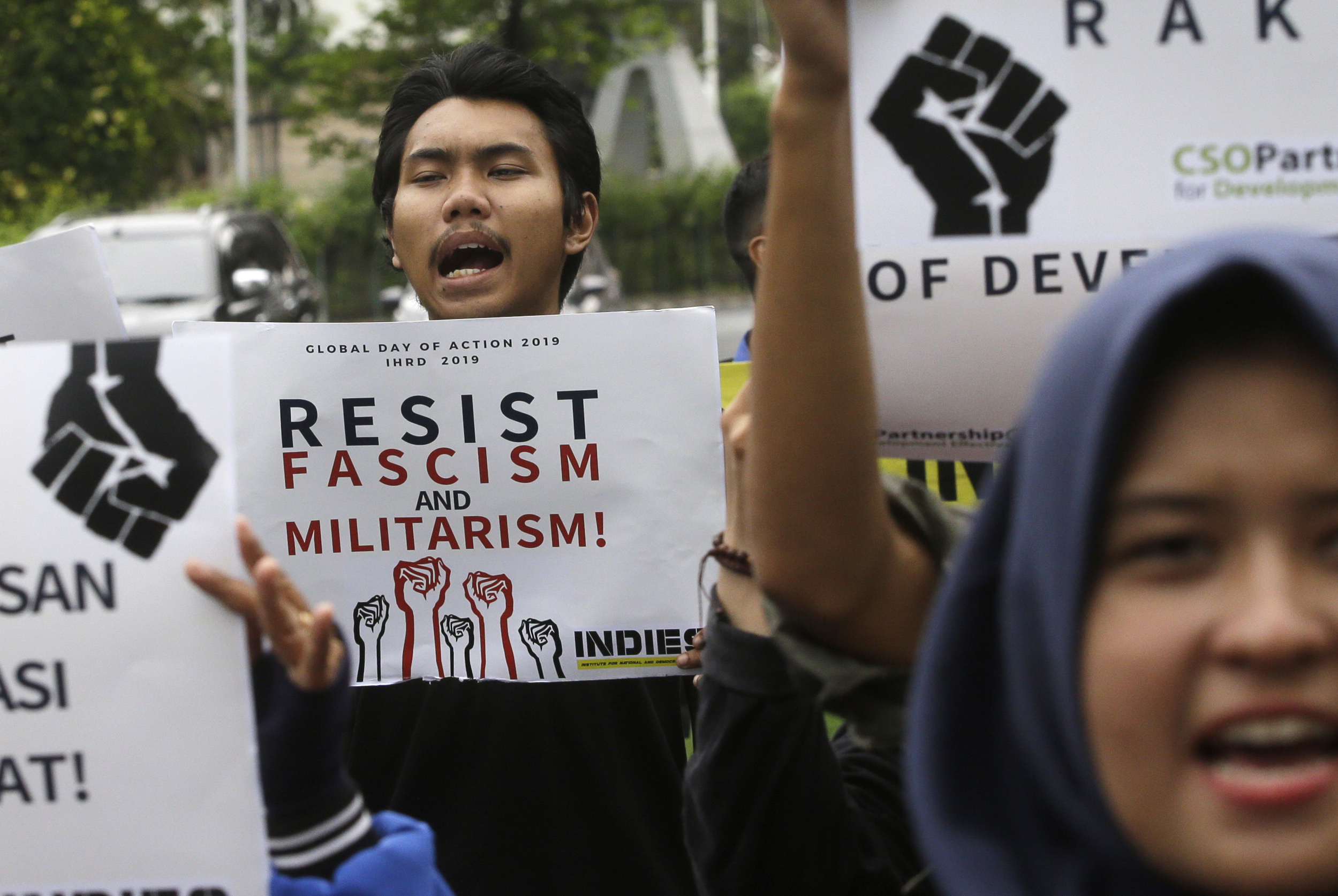 Activists shout slogans during rally to mark the Human Rights Day outside U.S. embassy in Jakarta, Indonesia, Tuesday, Dec. 10, 2019. Rights activists marched in Indonesia's capital Tuesday, calling on the government of the world's most populous Muslim and third largest democracy to protect and respect human rights.(AP Photo/Achmad Ibrahim)