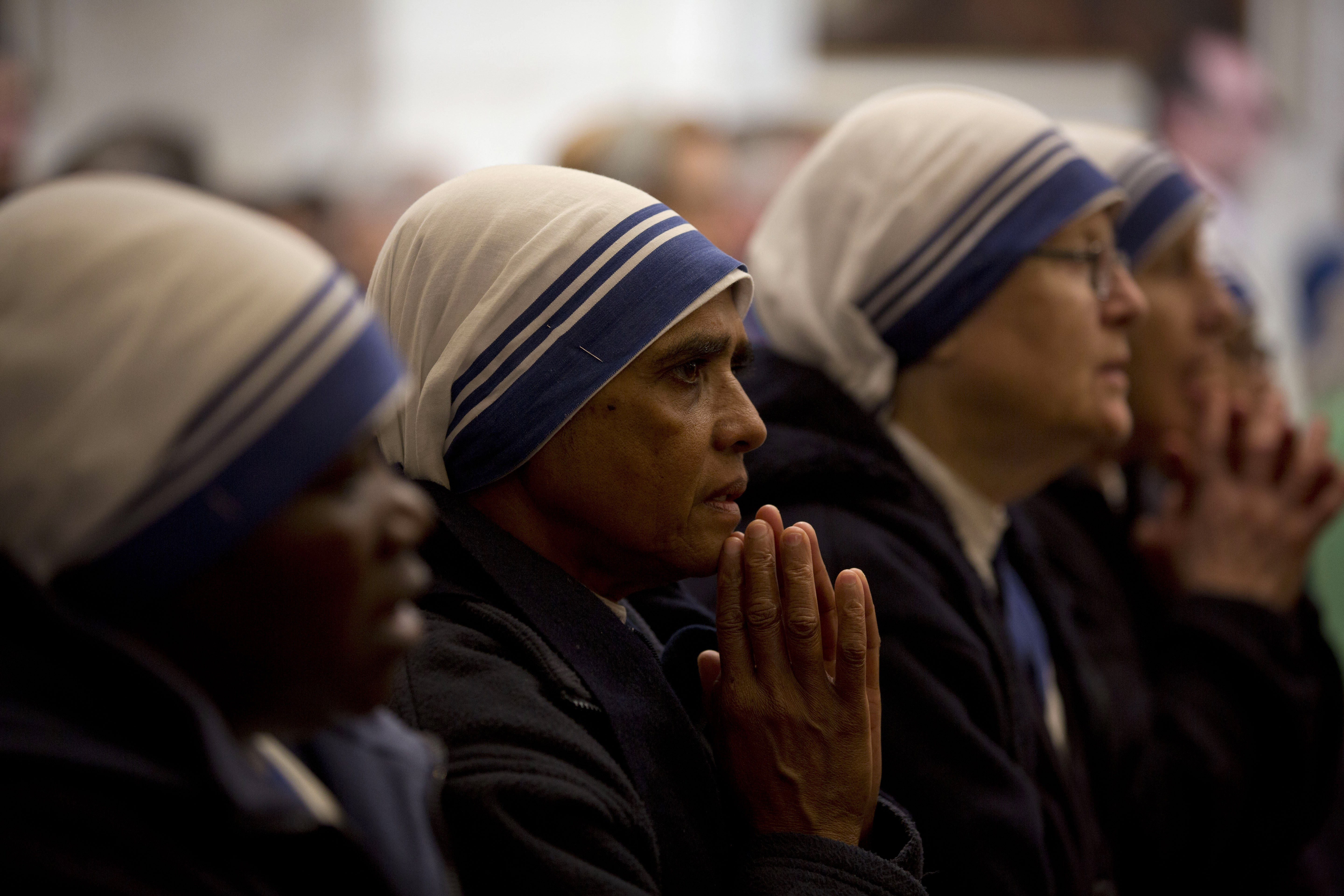 Nuns pray during a Christmas day Mass at the Church of the Nativity, traditionally believed to be the birthplace of Jesus Christ, in the West Bank town of Bethlehem, Wednesday, Dec. 25, 2019. (AP Photo/Majdi Mohammed)