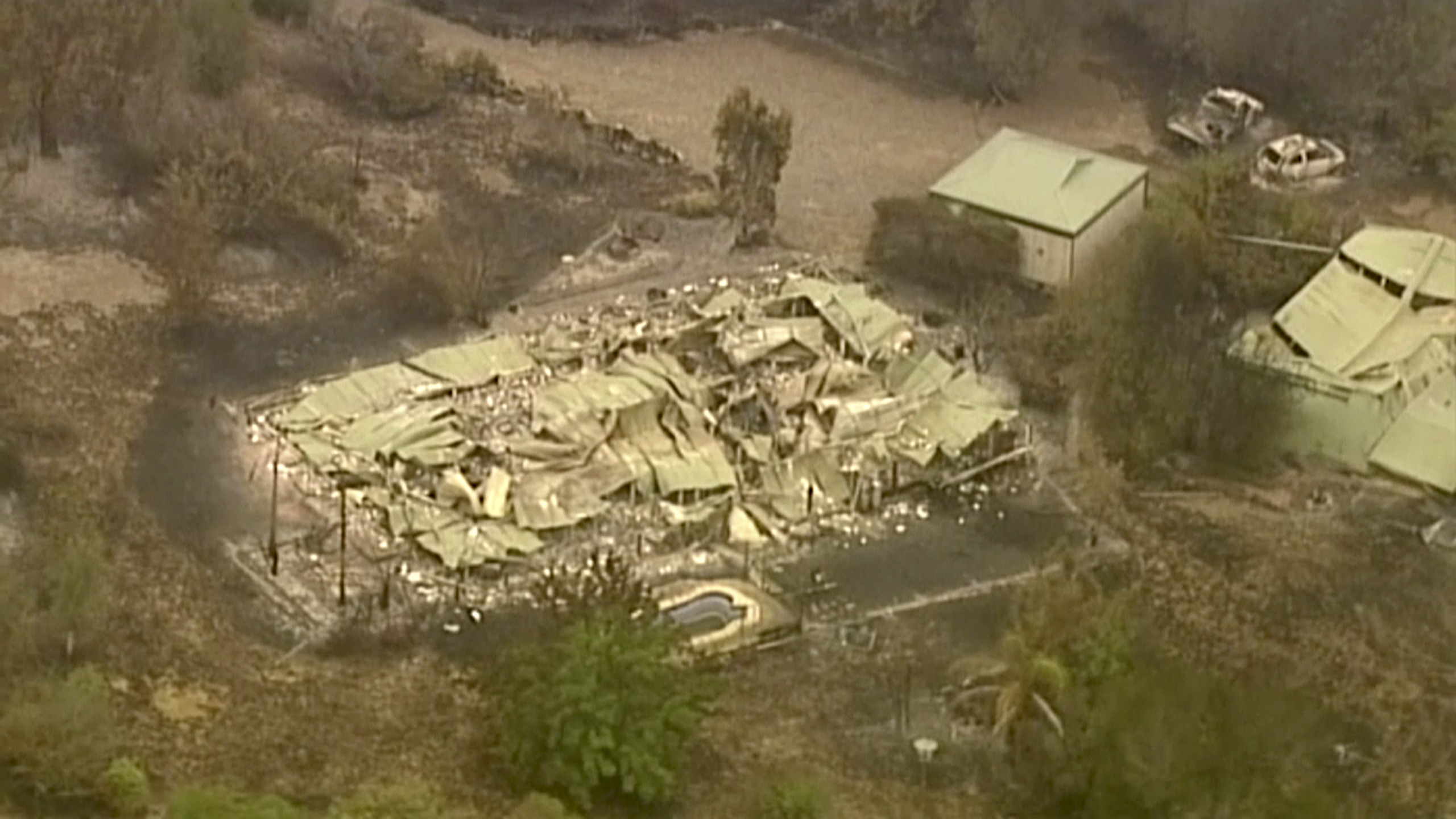 In this image made from video, an aerial scene shows destroyed properties after a wildfire in East Grippsland, Victoria, Wednesday, Jan. 1, 2020. Australia deployed military ships and aircraft to help communities ravaged by apocalyptic wildfires that destroyed homes and sent thousands of residents and holidaymakers fleeing to the shoreline.(Australian Broadcasting Corporation, Channel 7, Channel 9 via AP)