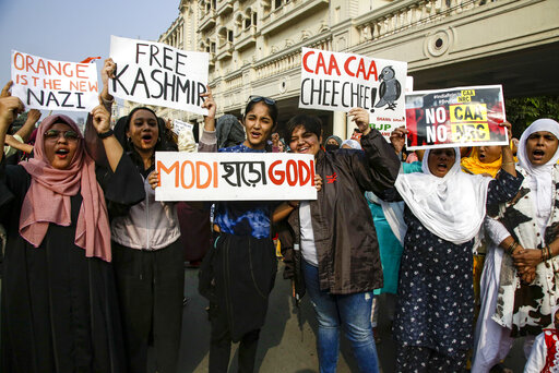 Indians shout slogans as they join a protest rally against a new citizenship law, in Kolkata, India, Friday, Jan. 10, 2020. The new citizenship law and a proposed National Register of Citizens have brought thousands of protesters out in the streets in many cities and towns since Parliament approved the measure on Dec. 11, leaving more than 20 dead in clashes between security forces and the protesters. (AP Photo/Bikas Das)