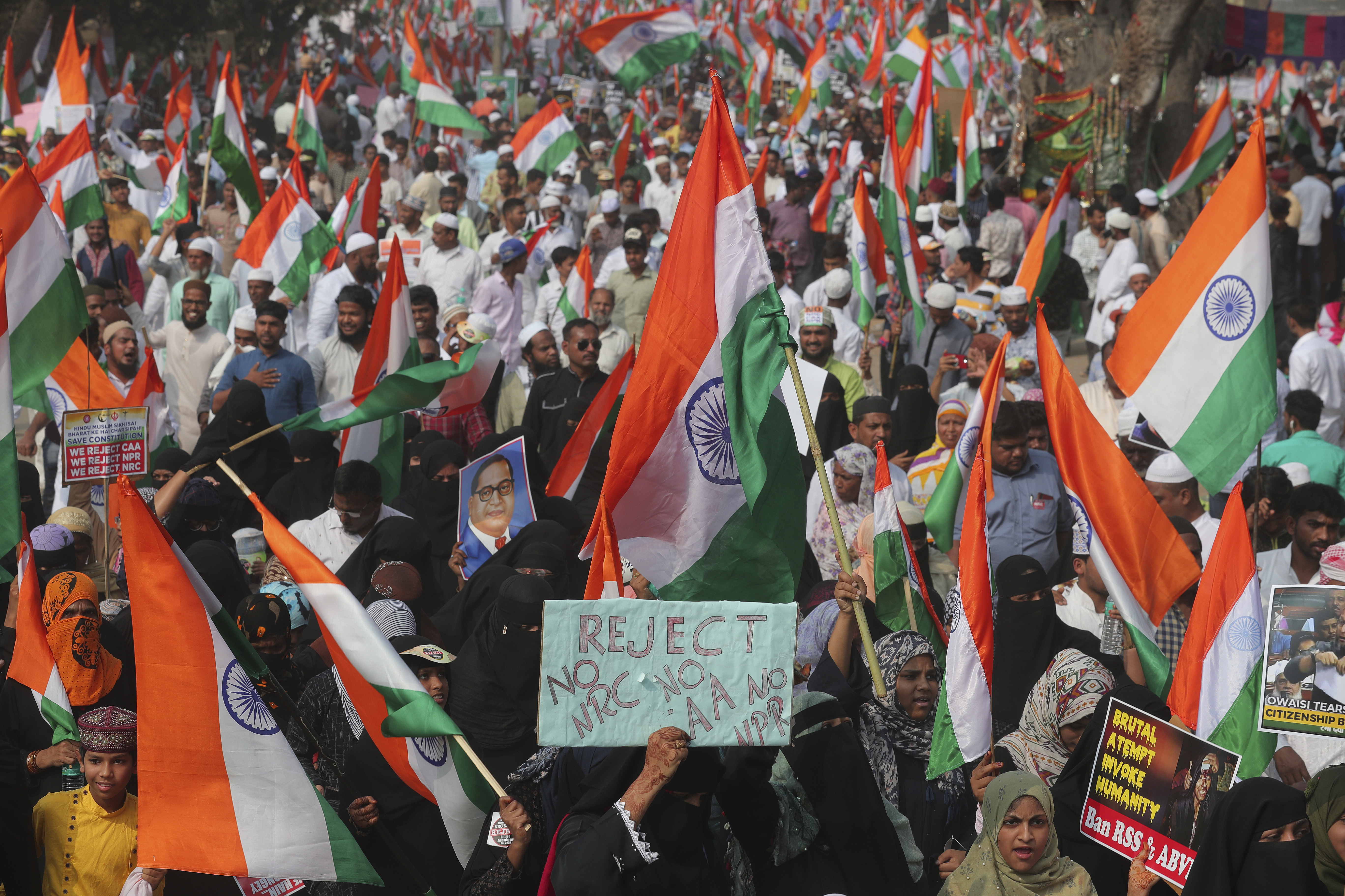 Indians participate in a protest against a new citizenship law that opponents say threatens India's secular identity, in Hyderabad, India, Friday, Jan. 10, 2020. The new citizenship law and a proposed National Register of Citizens have brought thousands of protesters out in the streets in many cities and towns since Parliament approved the measure on Dec. 11, leaving more than 20 dead in clashes between security forces and the protesters. (AP Photo/Mahesh Kumar A.)