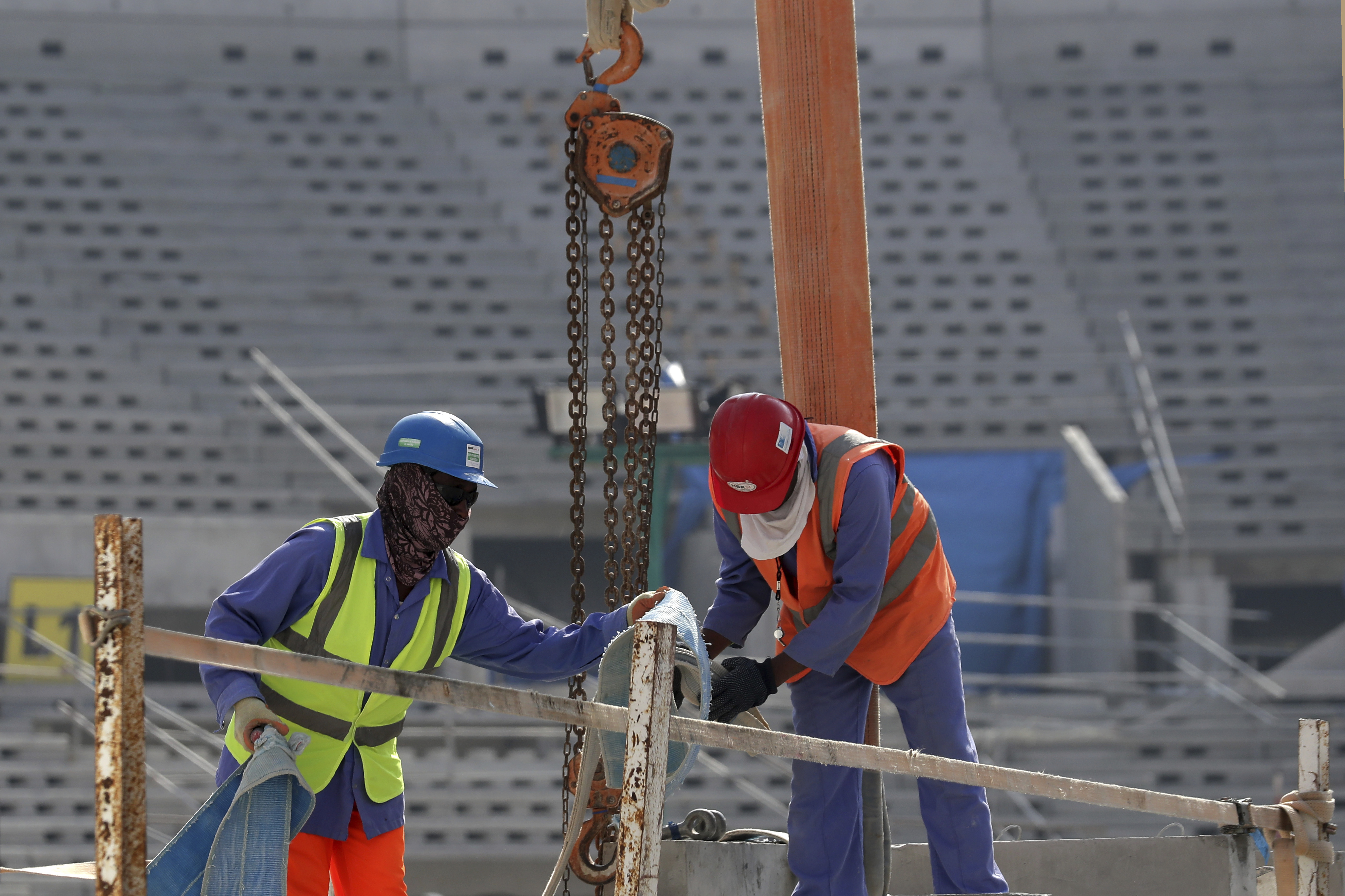 Workers work at Lusail Stadium, one of the 2022 World Cup stadiums, in Lusail, Qatar, Friday, Dec. 20, 2019. Construction is underway to complete Lusail's 80,000-seat venue for the opening game and final in a city that didn't exist when Qatar won the FIFA vote in 2010. (AP Photo/Hassan Ammar)