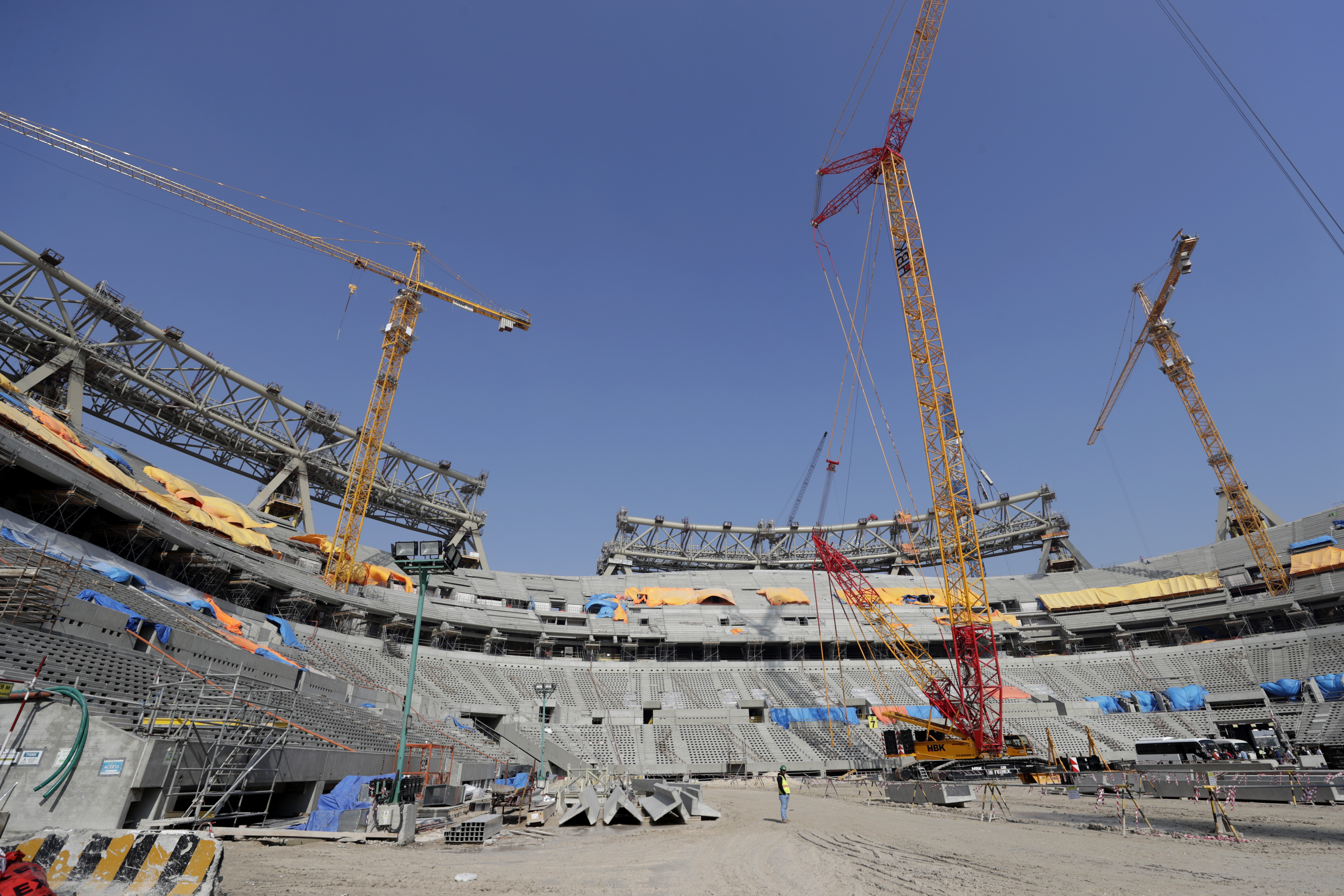 Workers work at Lusail Stadium, one of the 2022 World Cup stadiums, in Lusail, Qatar, Friday, Dec. 20, 2019. Construction is underway to complete Lusail's 80,000-seat venue for the opening game and final in a city that didn't exist when Qatar won the FIFA vote in 2010. (AP Photo/Hassan Ammar)