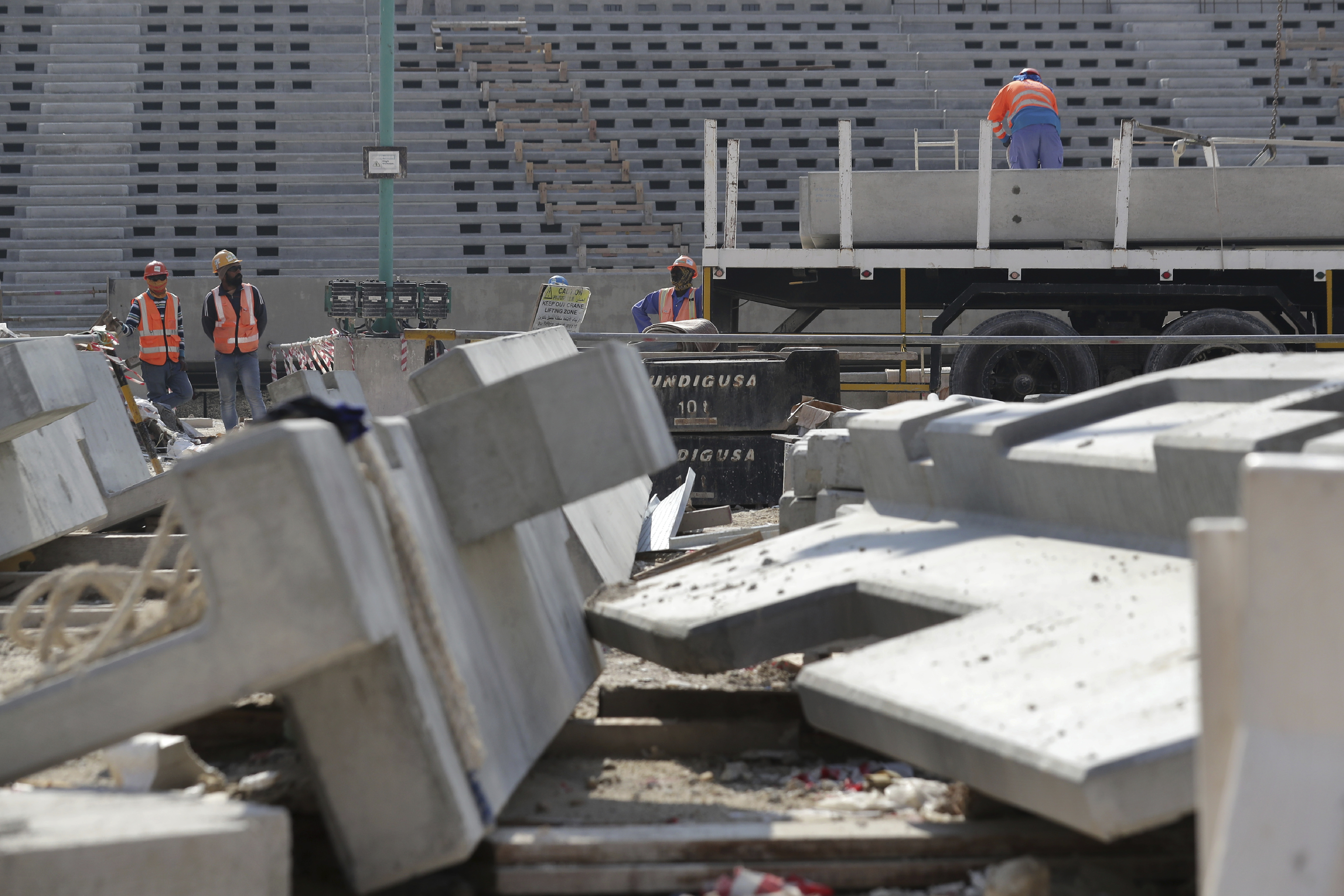 Workers work at Lusail Stadium, one of the 2022 World Cup stadiums, in Lusail, Qatar, Friday, Dec. 20, 2019. Construction is underway to complete Lusail's 80,000-seat venue for the opening game and final in a city that didn't exist when Qatar won the FIFA vote in 2010. (AP Photo/Hassan Ammar)