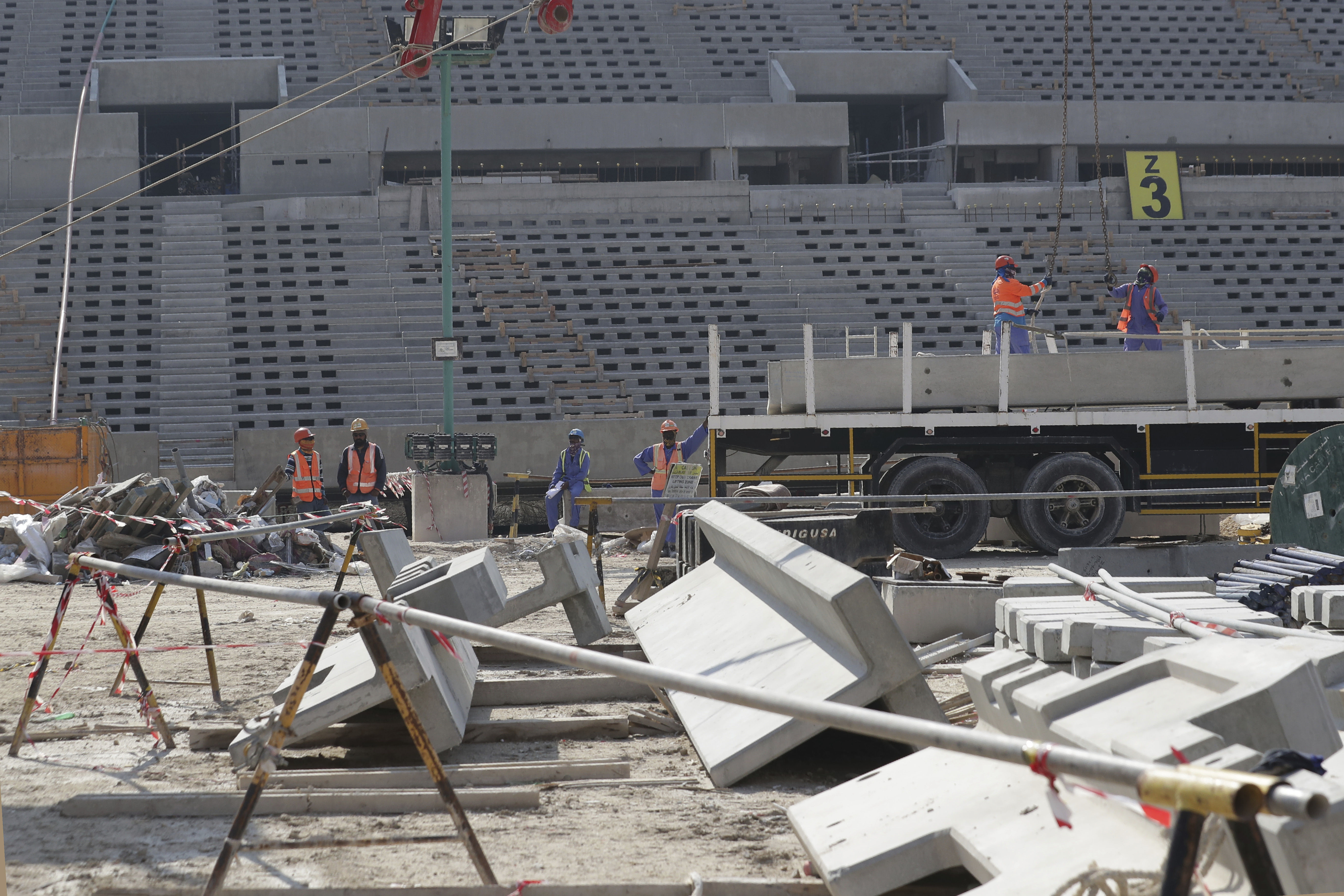 Workers work at Lusail Stadium, one of the 2022 World Cup stadiums, in Lusail, Qatar, Friday, Dec. 20, 2019. Construction is underway to complete Lusail's 80,000-seat venue for the opening game and final in a city that didn't exist when Qatar won the FIFA vote in 2010. (AP Photo/Hassan Ammar)