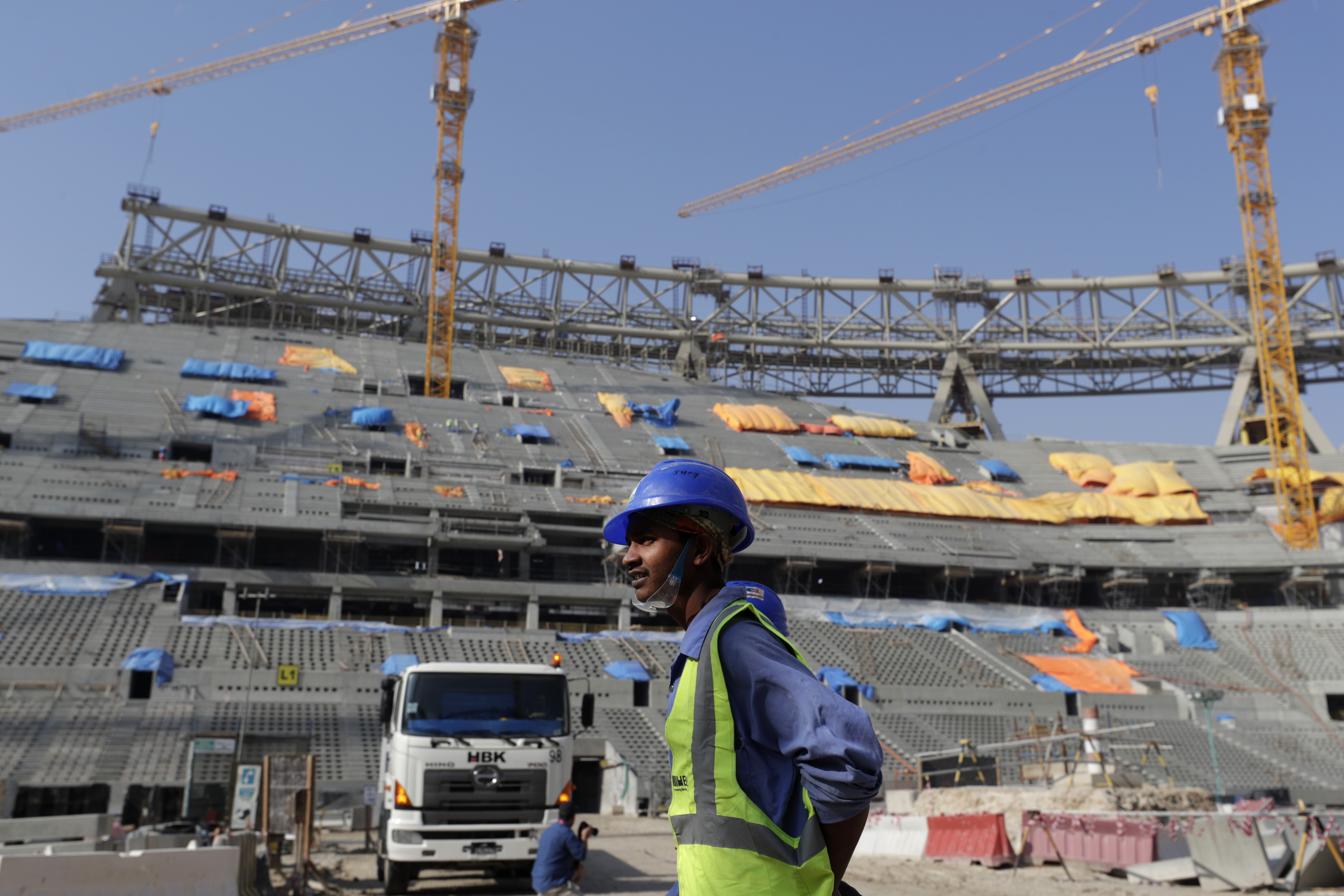 Workers work at Lusail Stadium, one of the 2022 World Cup stadiums, in Lusail, Qatar, Friday, Dec. 20, 2019. Construction is underway to complete Lusail's 80,000-seat venue for the opening game and final in a city that didn't exist when Qatar won the FIFA vote in 2010. (AP Photo/Hassan Ammar)