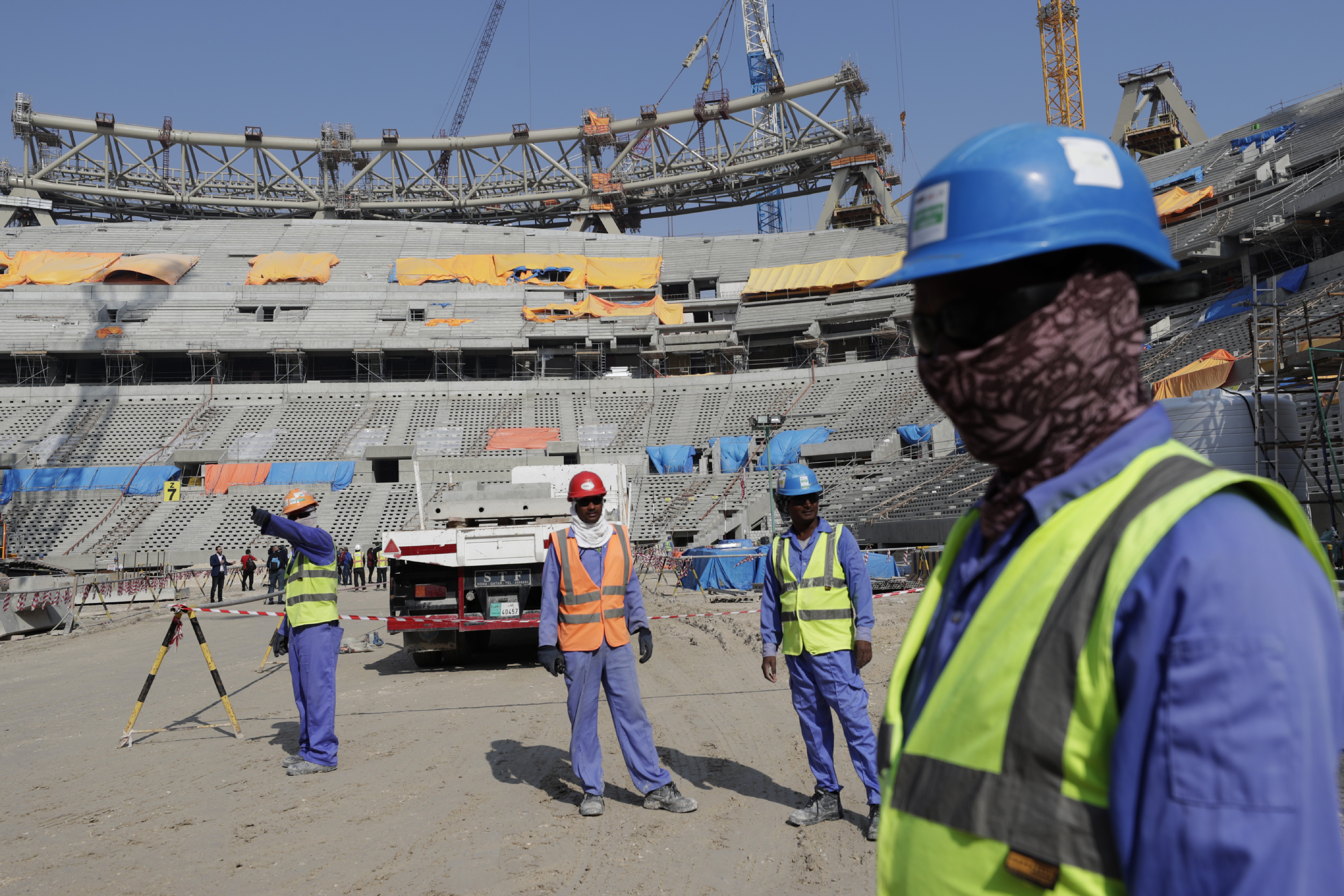 Workers work at Lusail Stadium, one of the 2022 World Cup stadiums, in Lusail, Qatar, Friday, Dec. 20, 2019. Construction is underway to complete Lusail's 80,000-seat venue for the opening game and final in a city that didn't exist when Qatar won the FIFA vote in 2010. (AP Photo/Hassan Ammar)