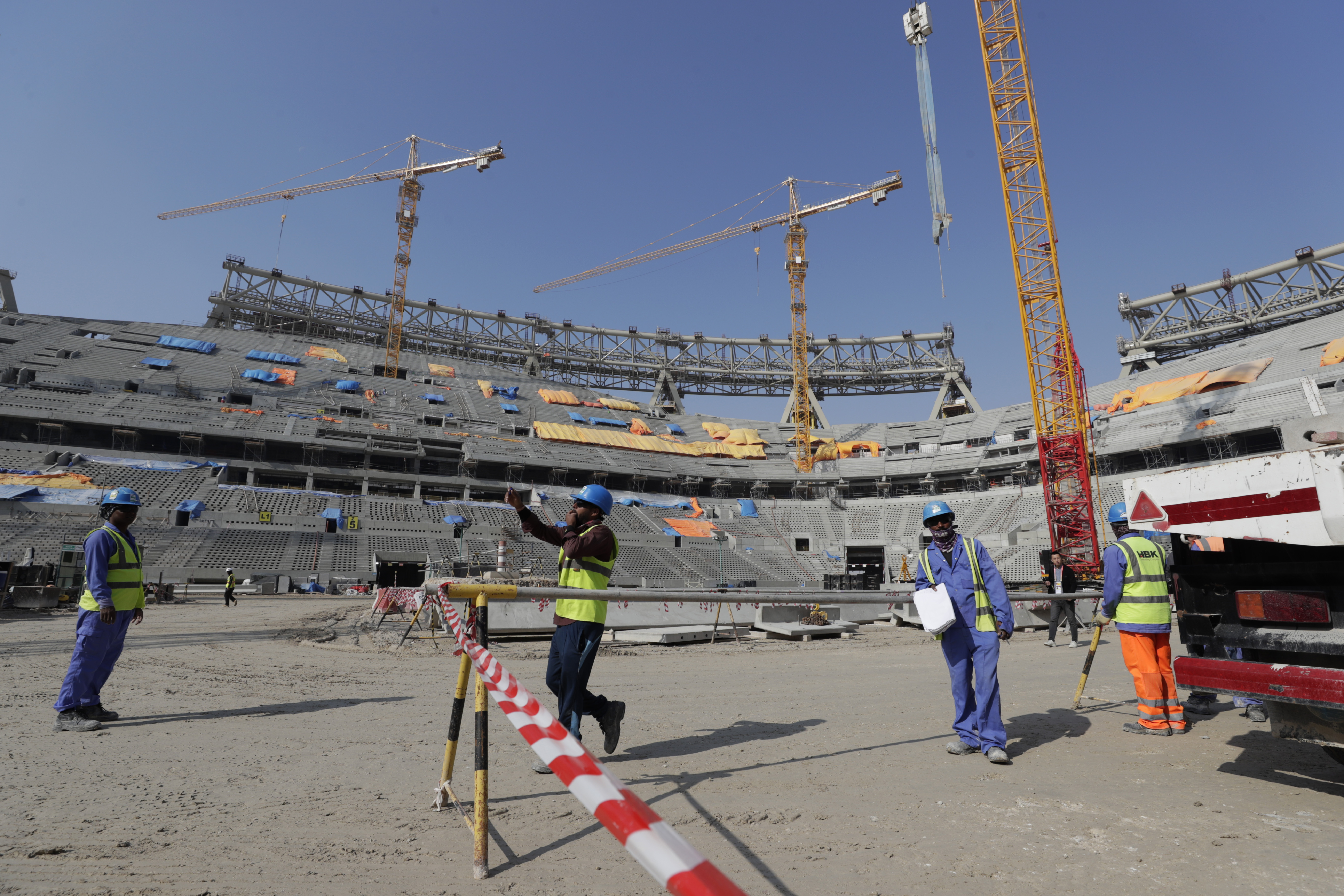 Workers work at Lusail Stadium, one of the 2022 World Cup stadiums, in Lusail, Qatar, Friday, Dec. 20, 2019. Construction is underway to complete Lusail's 80,000-seat venue for the opening game and final in a city that didn't exist when Qatar won the FIFA vote in 2010. (AP Photo/Hassan Ammar)