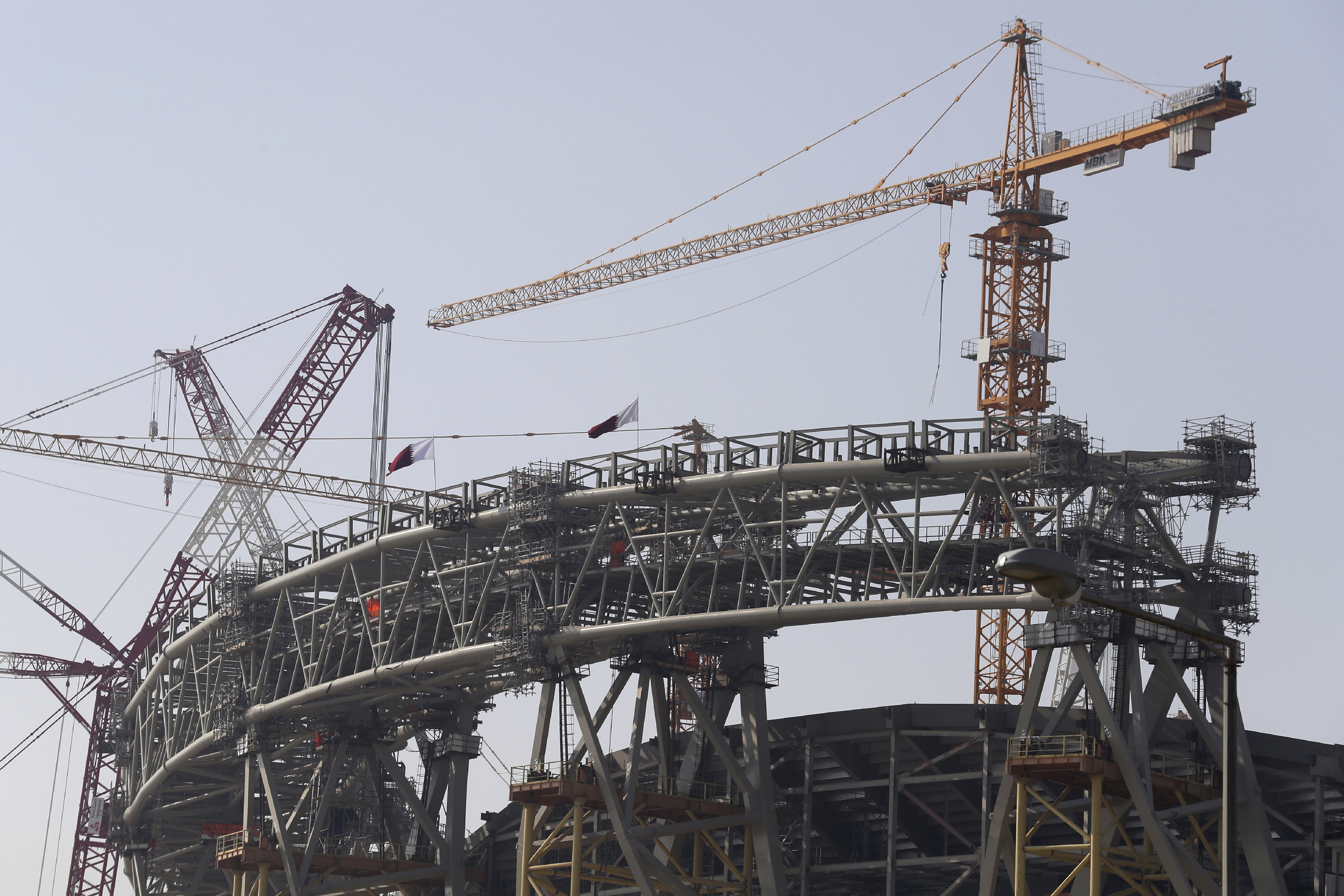 Workers work at Lusail Stadium, one of the 2022 World Cup stadiums, in Lusail, Qatar, Friday, Dec. 20, 2019. Construction is underway to complete Lusail's 80,000-seat venue for the opening game and final in a city that didn't exist when Qatar won the FIFA vote in 2010. (AP Photo/Hassan Ammar)