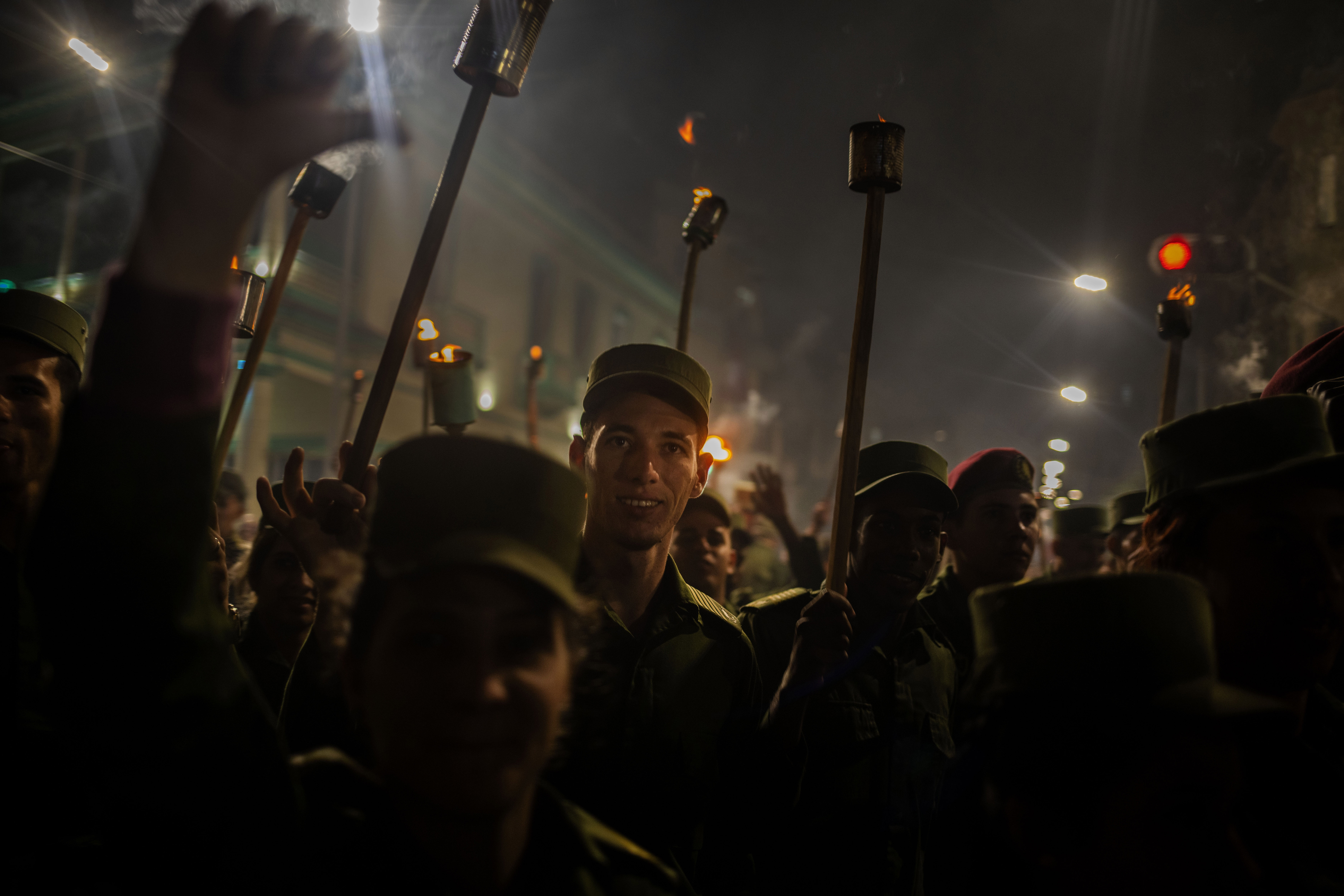 People take part in a march with torches to mark the 167th anniversary of the birth of Cuba's national independence hero Jose Marti, in Havana, Cuba, Monday, Jan. 27, 2020. (AP Photo/Ramon Espinosa)