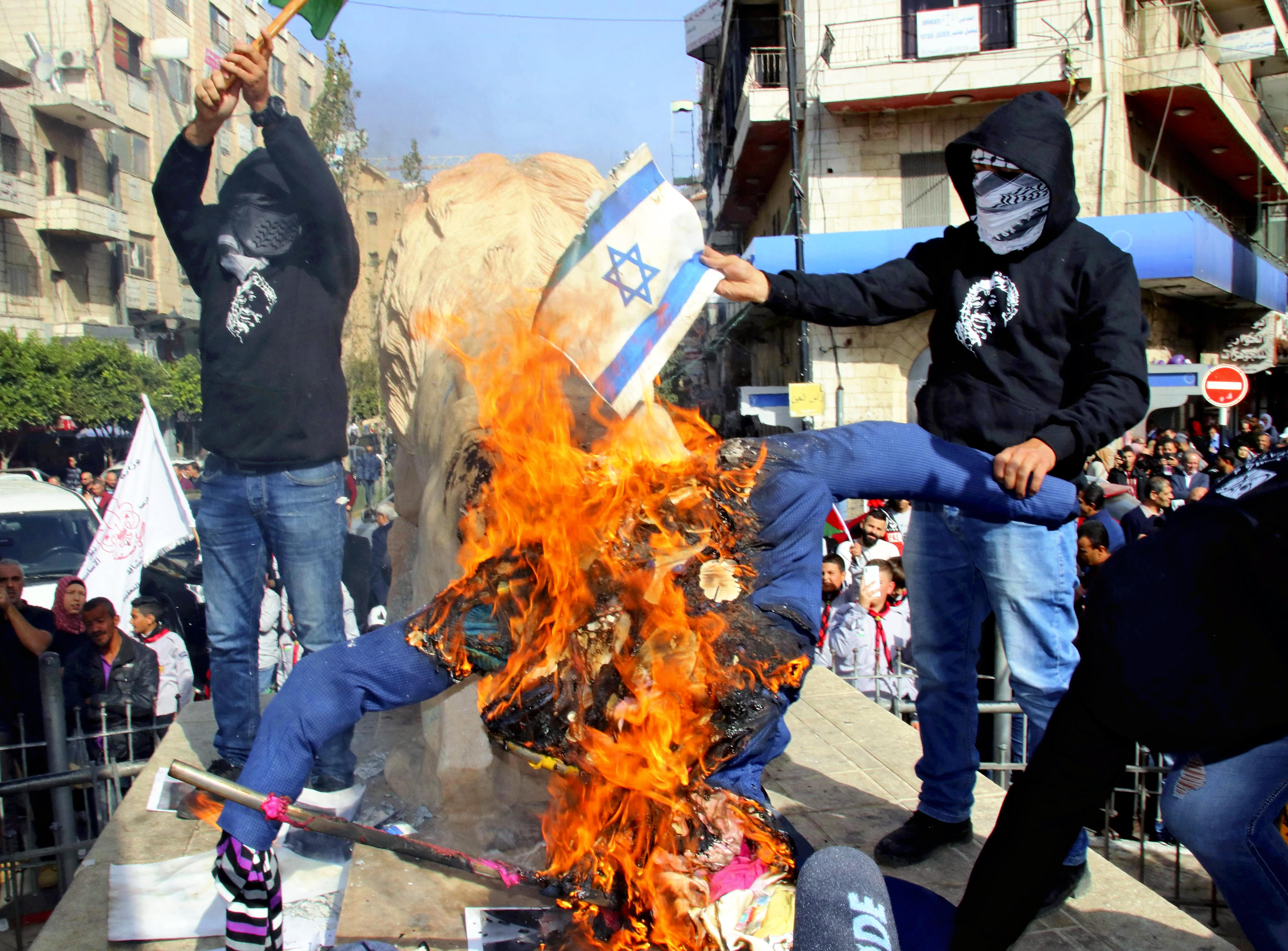 Palestinians protest as the Trump administration's decided to treat Israel's settlement enterprise as a legal endeavor in Ramallah on Nov. 26, 2019.( The Yomiuri Shimbun via AP Images )