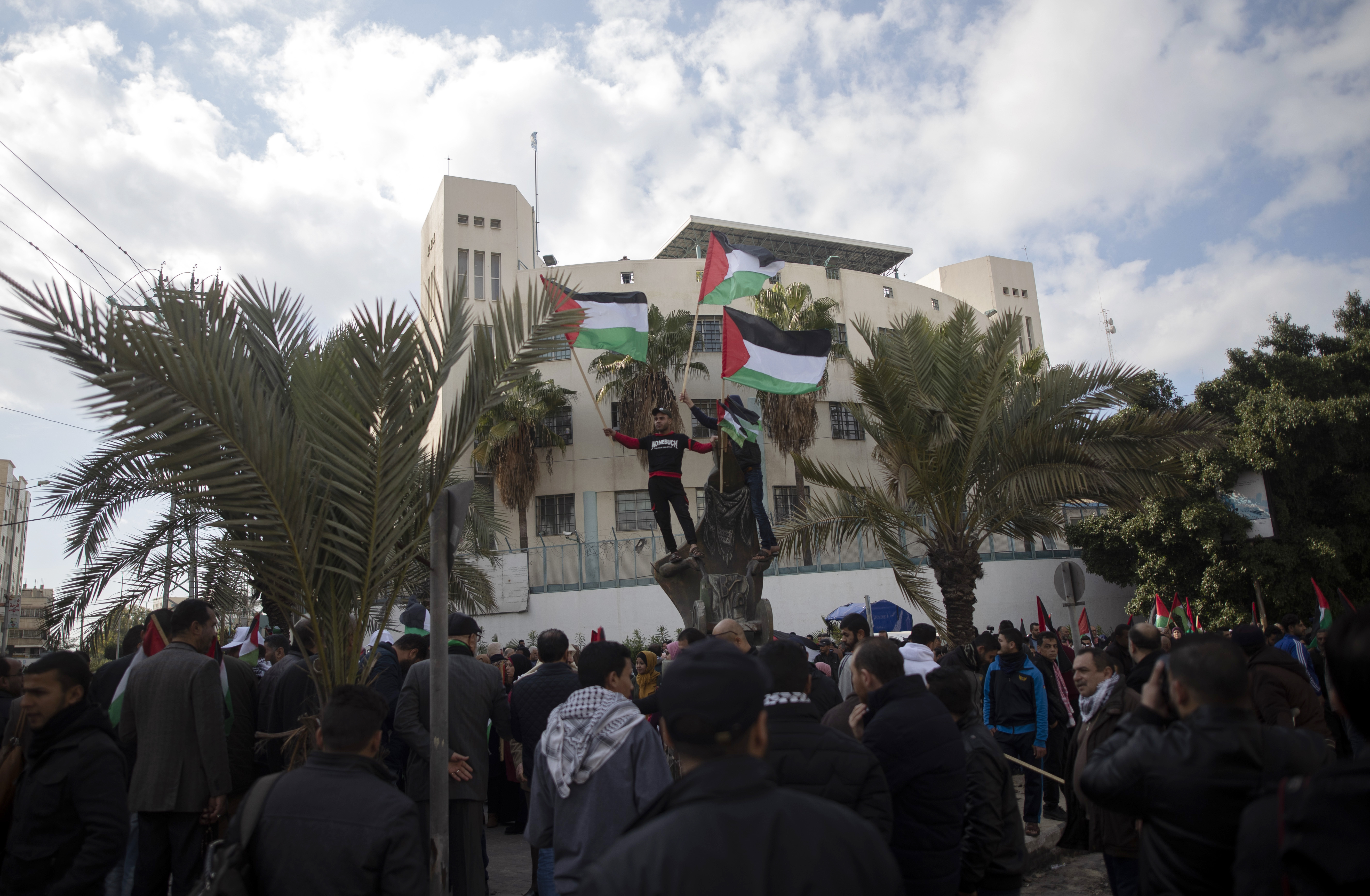 Palestinian wave national flags as they attended a protest against the U.S. Mideast peace plan, in Gaza City, Monday, Jan. 28, 2020. U.S. President Donald Trump is set to unveil his administration's much-anticipated Mideast peace plan in the latest U.S. venture to resolve the Israeli-Palestinian conflict. (AP Photo/Khalil Hamra)