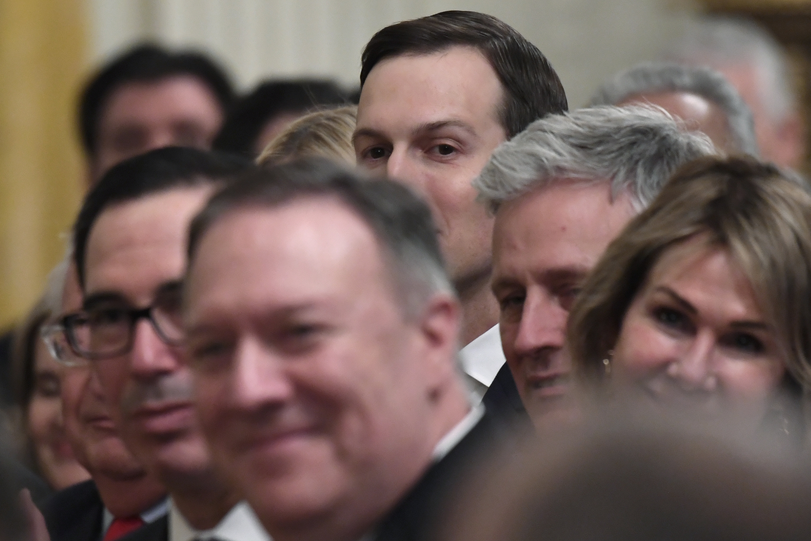 White House senior adviser Jared Kushner, center, listens during an event with President Donald Trump and Israeli Prime Minister Benjamin Netanyahu in the East Room of the White House in Washington, Tuesday, Jan. 28, 2020, announcing the Trump administration's much-anticipated plan to resolve the Israeli-Palestinian conflict. Also attending the event is, from left, Treasury Secretary Steven Mnuchin, Secretary of State Mike Pompeo, National Security Advisor Robert O'Brien, and U.S. Ambassador to the U.N. Kelly Craft. (AP Photo/Susan Walsh)