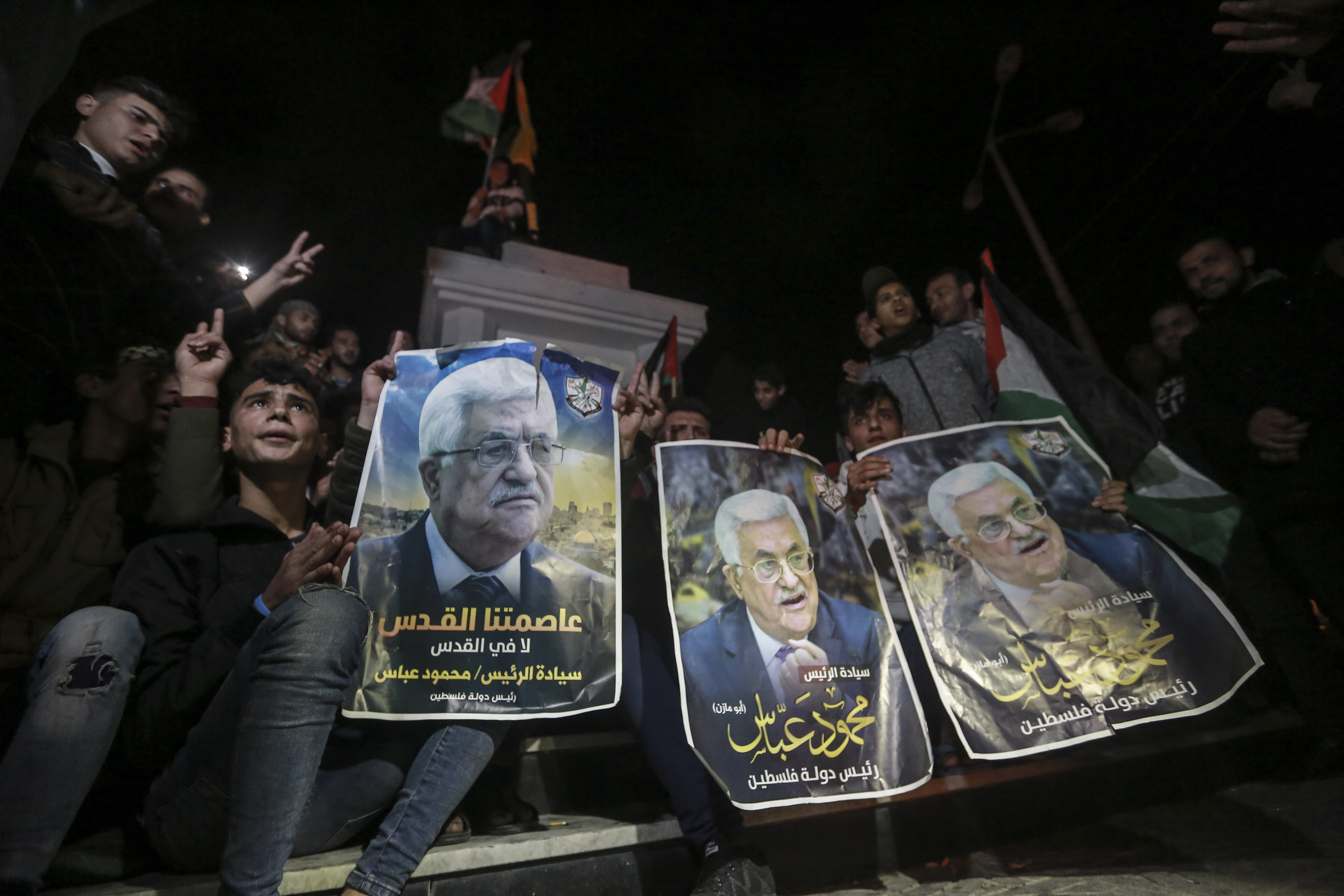 28 January 2020, Palestinian Territories, Gaza City: Palestinian demonstrators hold pictures of Palestinian President Mahmoud Abbas during a demonstration against US President Donald Trump's Middle East peace plan. Photo by: Mohammed Talatene/picture-alliance/dpa/AP Images
