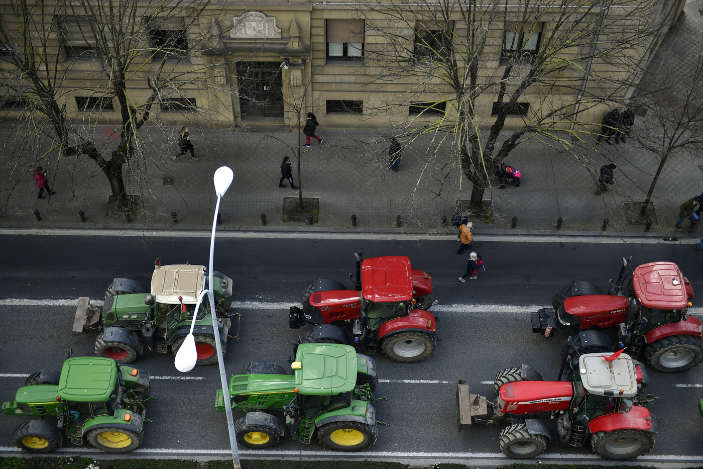 Farmers block the center of the city with their tractors during a protest in Pamplona, northern Spain, Wednesday, Feb. 19, 2020. Farmers across Spain are taking part in mass protests over what they say are plummeting incomes for agricultural workers. (AP Photo/Alvaro Barrientos)