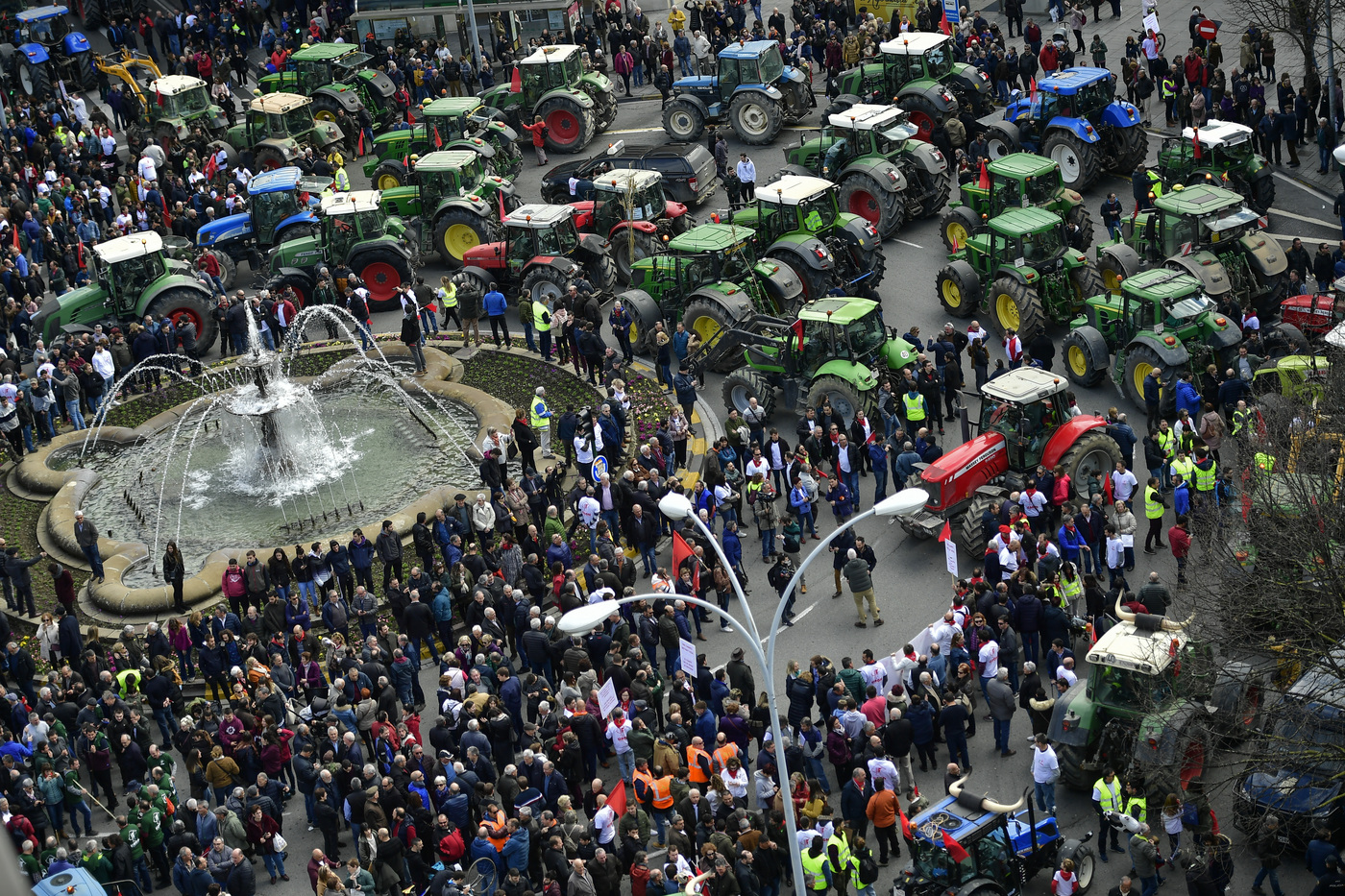 Farmers block the center of the city with their tractors during a protest in Pamplona, northern Spain, Wednesday, Feb. 19, 2020. Farmers across Spain are taking part in mass protests over what they say are plummeting incomes for agricultural workers. (AP Photo/Alvaro Barrientos)
