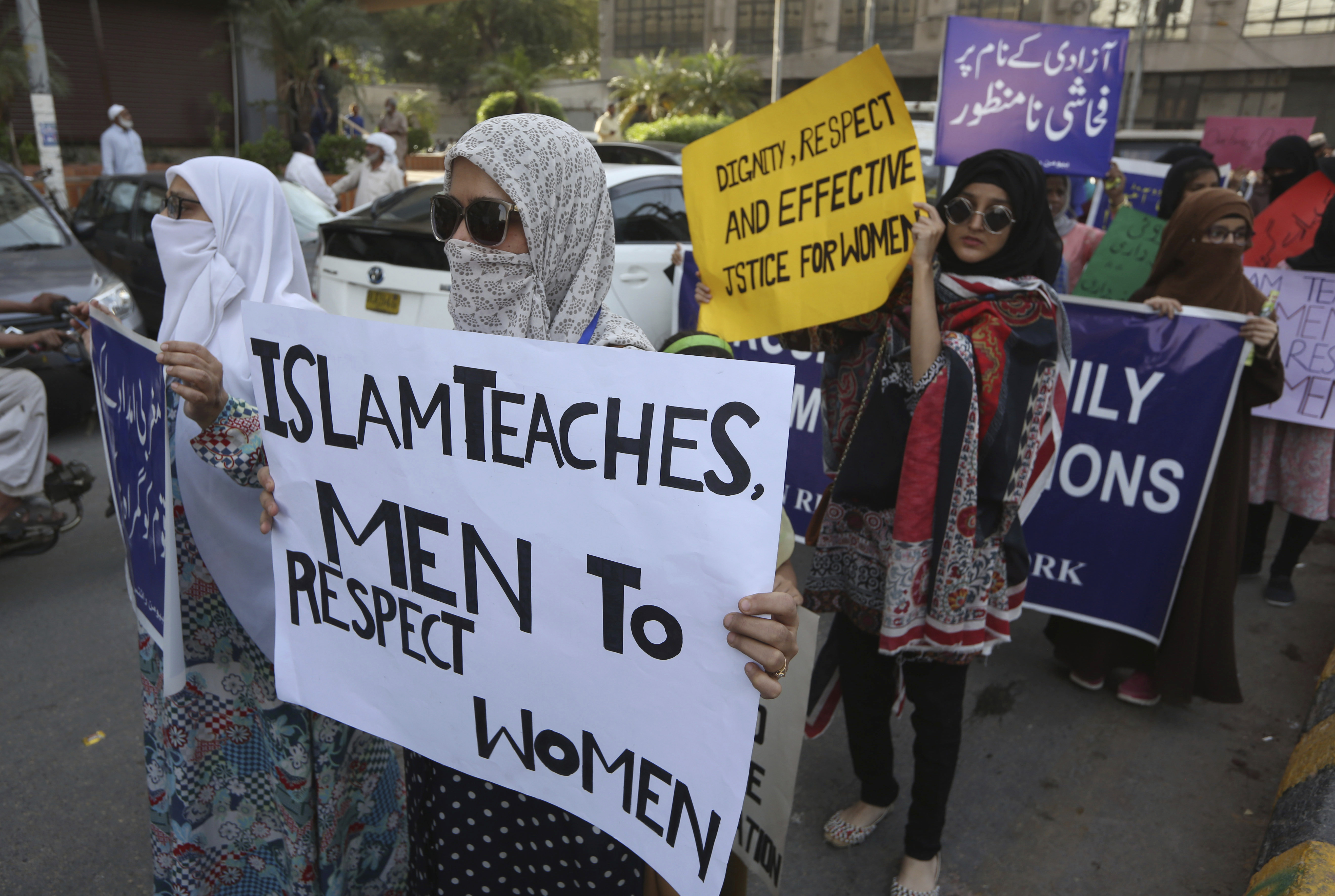 Pakistanis take party in a pro-women rally ahead of Women's Day in Karachi, Pakistan, Friday, March 6, 2020. Pakistani women plan to hold rallies across the country to celebrate International Women's Day to bring attention to their efforts to seek better jobs, protections in the work place and end domestic violence. (AP Photo/Fareed Khan)