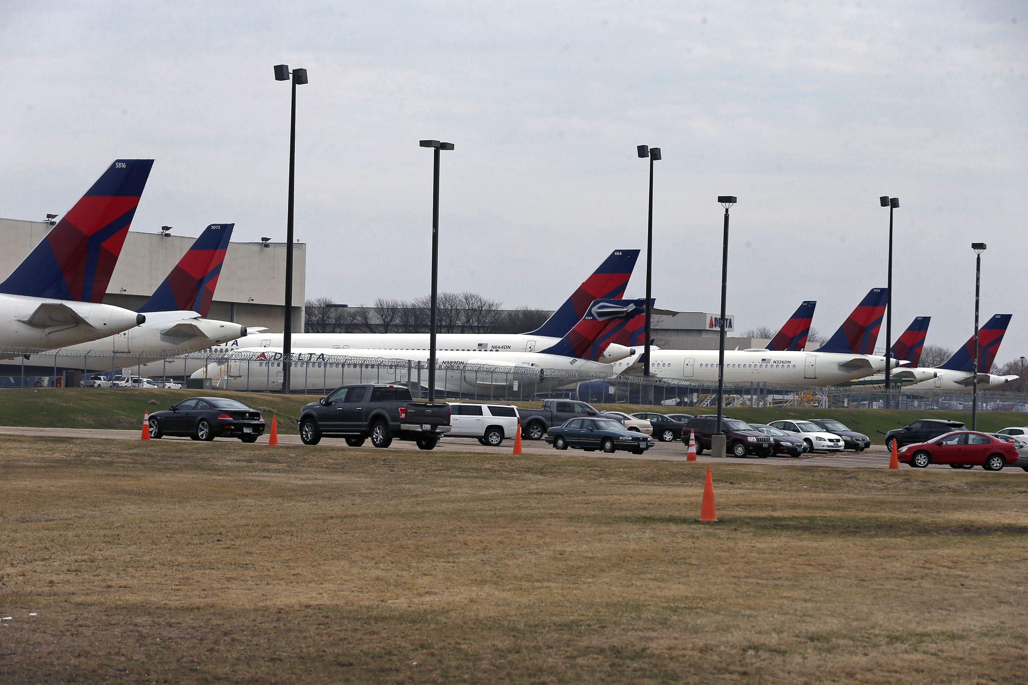 Delta Air Lines planes sit idle at a hangar at Minneapolis-St. Paul International Airport, Thursday, April 2, 2020, as the coronavirus continues to spread. (AP Photo/Jim Mone)
