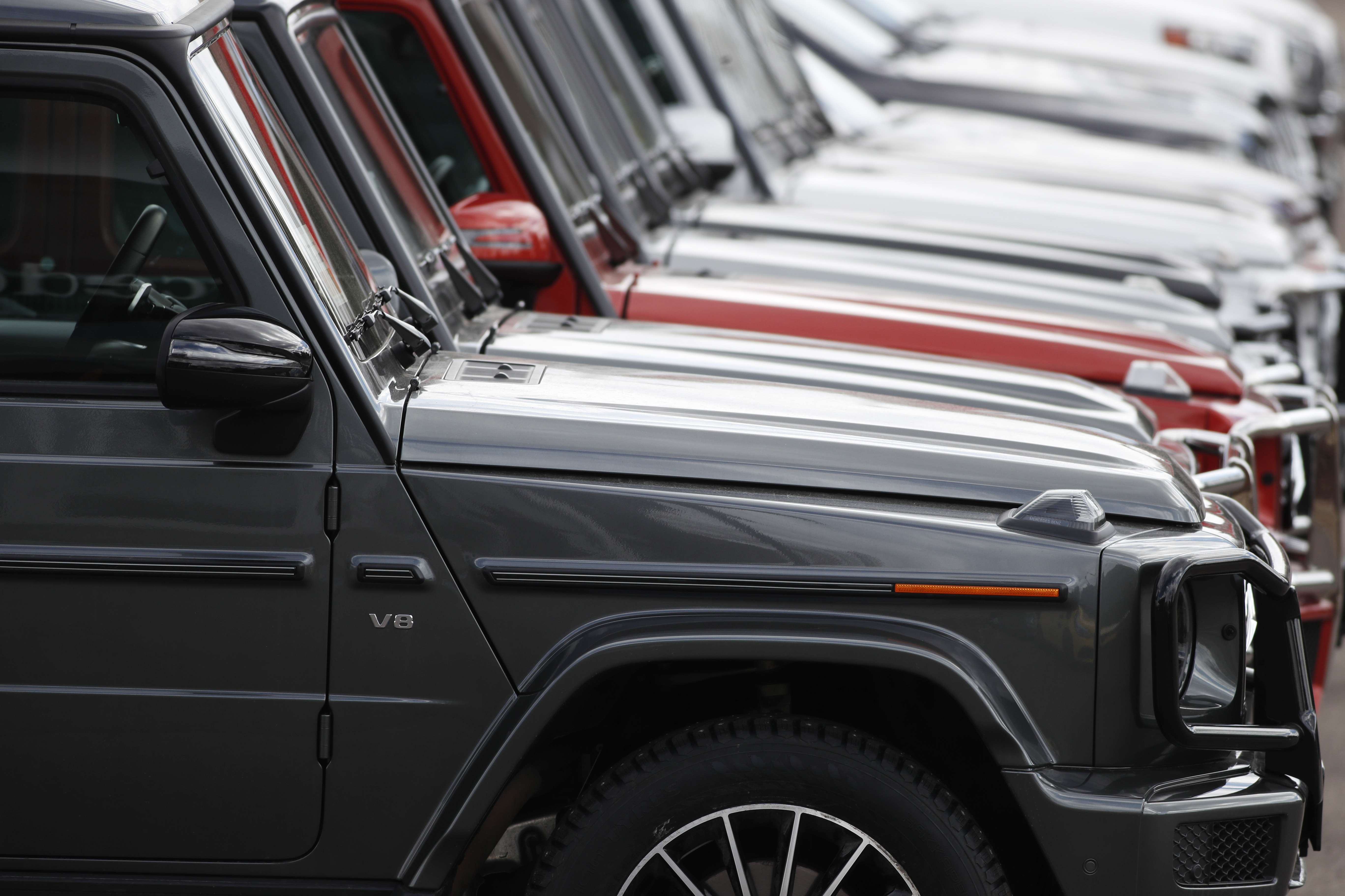 In this Sunday, April 5, 2020, photograph, a long row of unsold 2020 G63 sports-utility vehicles sits at a Mercedes Benz dealership in Littleton, Colo. (AP Photo/David Zalubowski)