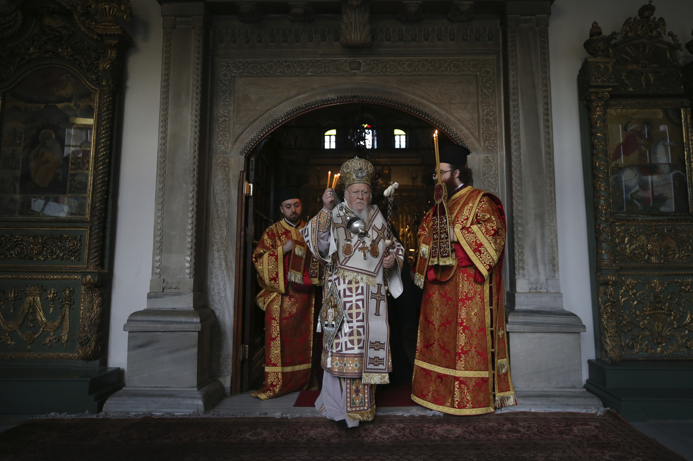 Ecumenical Patriarch Bartholomew I, the spiritual leader of the world's Orthodox Christians leads the Good Friday procession of the Epitaphios  during Orthodox Easter Week services, held without worshippers to help contain the spread of coronavirus at the Patriarchal Church of St. George in Istanbul, Friday, April 17, 2020.For Orthodox Christians, this is normally a time of reflection and joy, of centuries-old ceremonies steeped in symbolism and tradition. But this year, Easter, by far the most significant religious holiday for the world's roughly 300 million Orthodox, has essentially been cancelled in a world locked down by the COVID-19 pandemic. (AP Photo/Emrah Gurel, Pool)