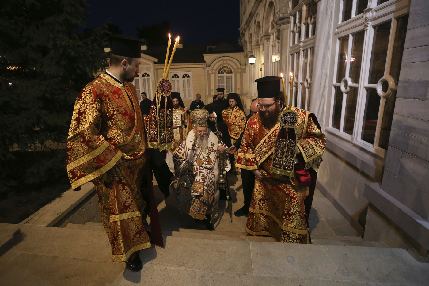 Ecumenical Patriarch Bartholomew I, the spiritual leader of the world's Orthodox Christians leads the Good Friday procession of the Epitaphios  during Orthodox Easter Week services, held without worshippers to help contain the spread of coronavirus at the Patriarchal Church of St. George in Istanbul, Friday, April 17, 2020.For Orthodox Christians, this is normally a time of reflection and joy, of centuries-old ceremonies steeped in symbolism and tradition. But this year, Easter, by far the most significant religious holiday for the world's roughly 300 million Orthodox, has essentially been cancelled in a world locked down by the COVID-19 pandemic. (AP Photo/Emrah Gurel, Pool)