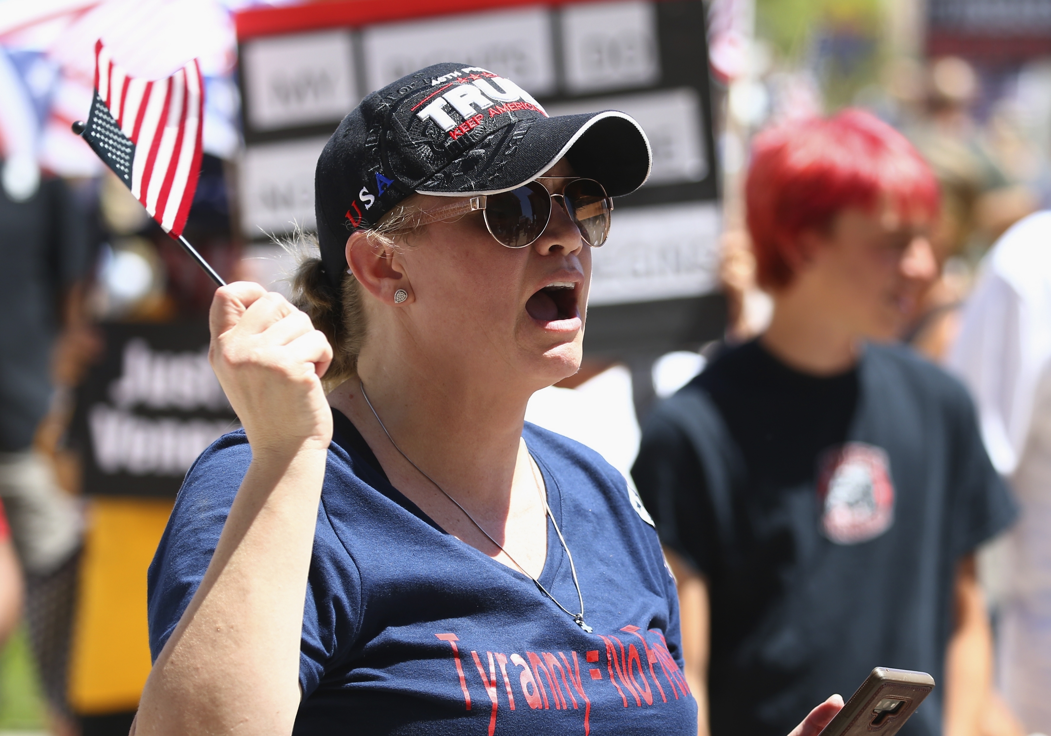 A protester shouts at a rally at the Capitol to 're-open' Arizona against the governor's stay-at-home order due to the coronavirus Monday, April 20, 2020, in Phoenix. (AP Photo/Ross D. Franklin)