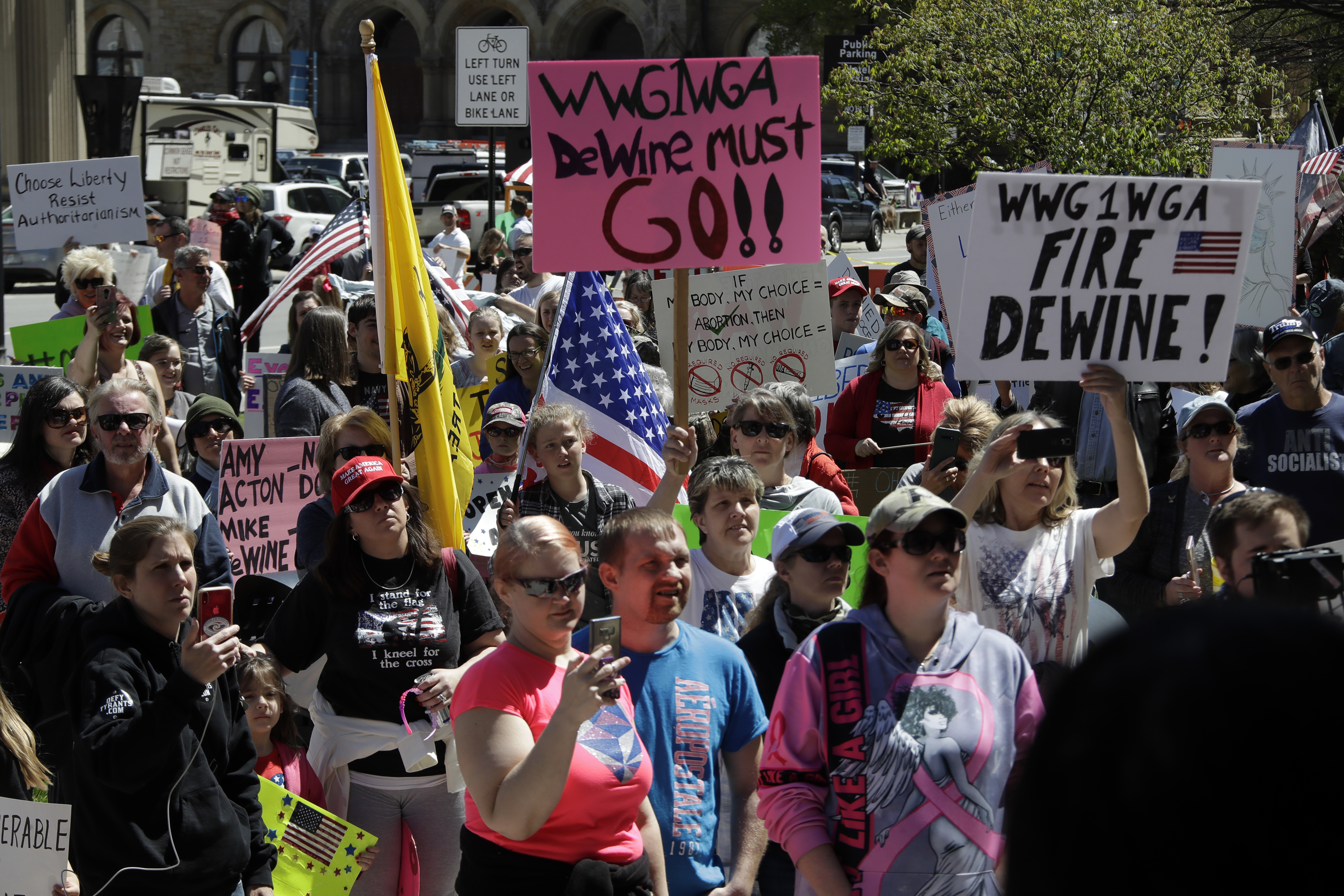 Protesters gather outside of the Ohio State House in Columbus, Ohio on April 20, 2020, to protest the stay home order that is in effect until May 1. (AP Photo/Gene J. Puskar)