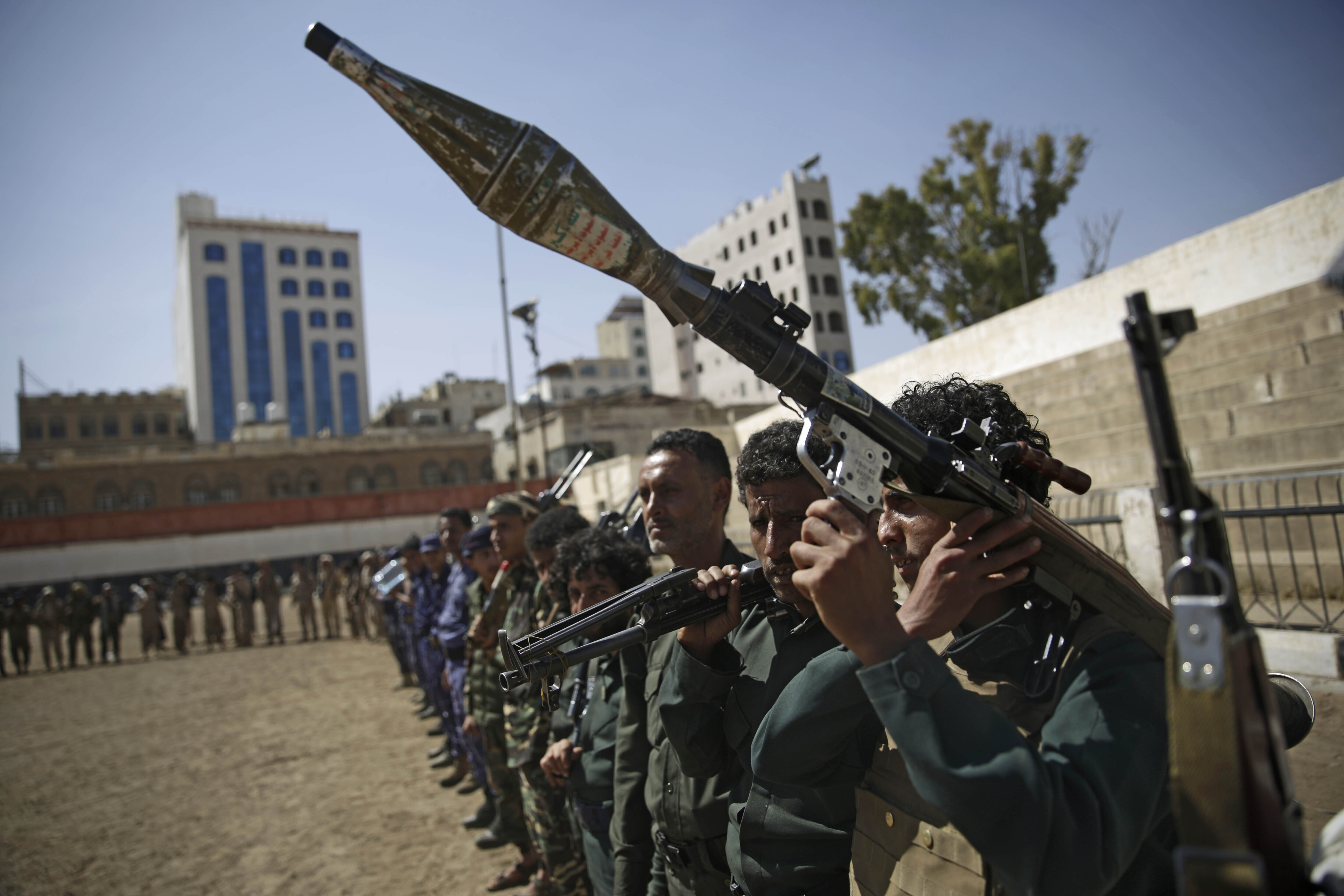 Houthi rebel fighters display their weapons during a gathering aimed at mobilizing more fighters for the Iranian-backed Houthi movement, in Sanaa, Yemen, Thursday, Feb. 20, 2020. The Houthi rebels control the capital, Sanaa, and much of the country’s north, where most of the population lives. They are at war with a U.S.-backed, Saudi-led coalition fighting on behalf of the internationally recognized government. (AP Photo/Hani Mohammed)