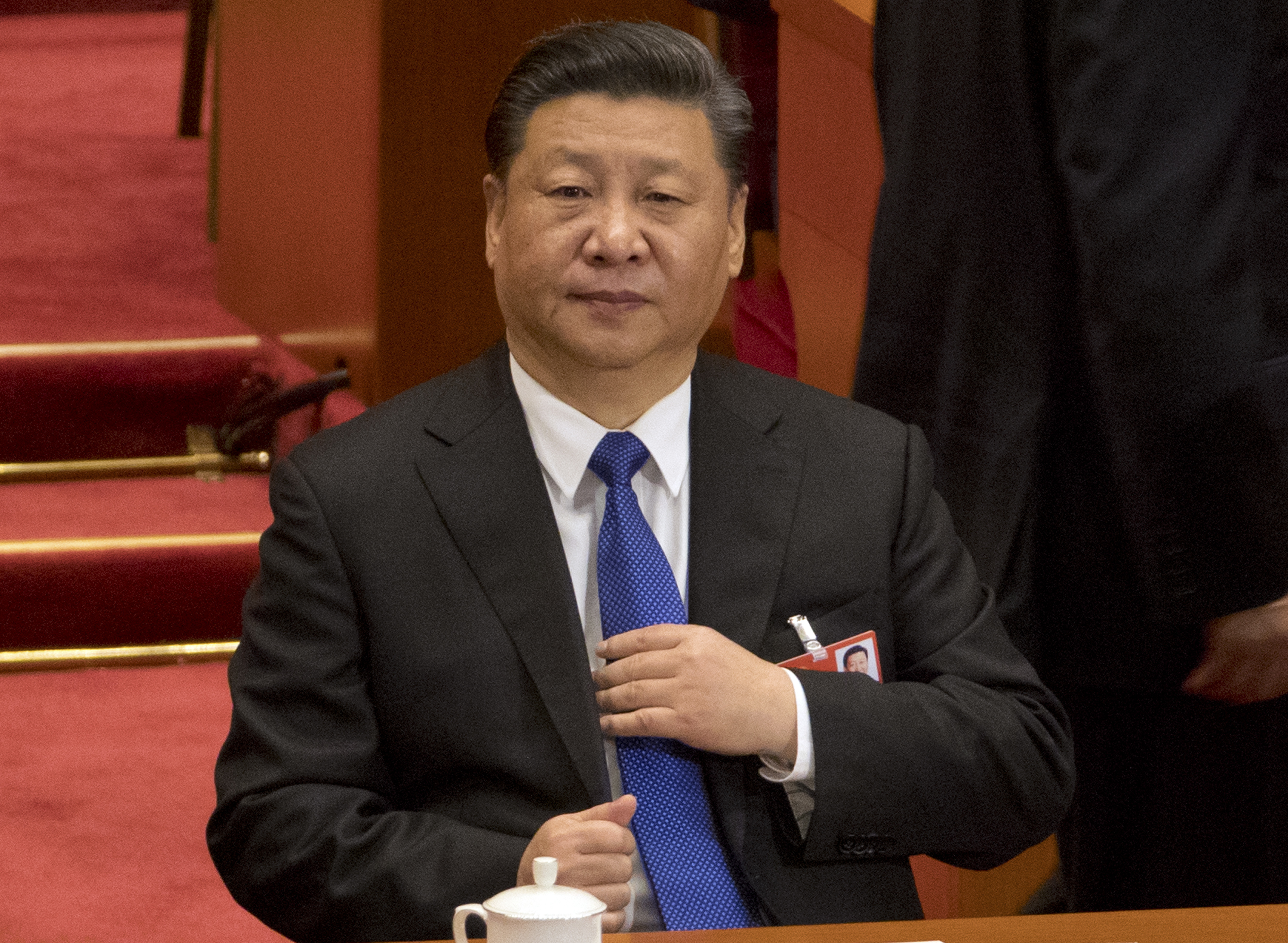 FILE - In this file photo taken Monday, March 19, 2018, Chinese President Xi Jinping attends a plenary session of China's National People's Congress (NPC) at the Great Hall of the People in Beijing. Chinese envoys have set off diplomatic firestorms with a combative defense whenever their country is accused of not acting quickly enough to stem the spread of the coronavirus pandemic. Xi's government has urged its diplomats to pursue 
