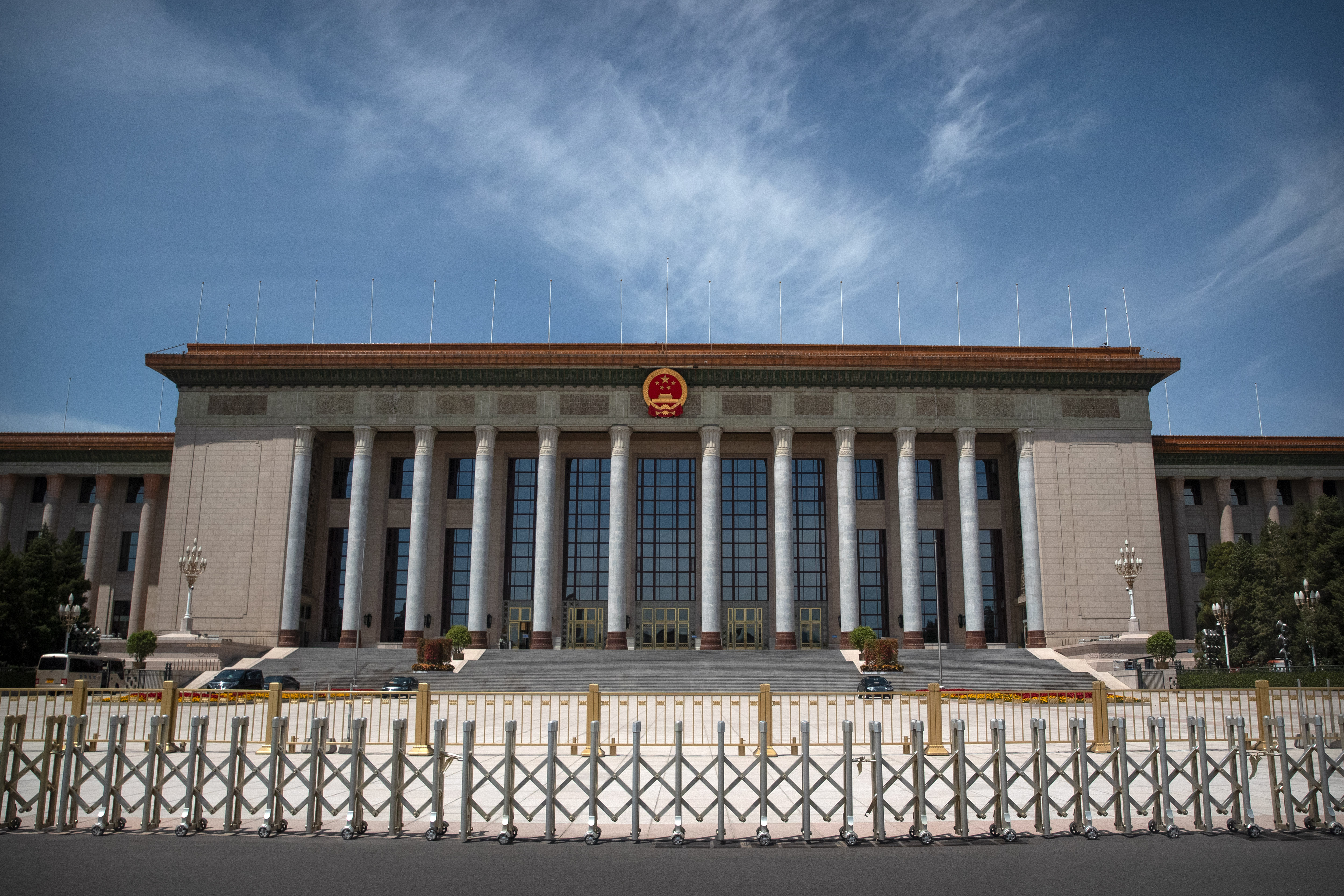 In this Wednesday, May 20, 2020, photo, barricades are pulled in front of the Great Hall of the People in Beijing. This year's version of China's biggest political meeting of the year will be unlike any other. Delayed from March because of the then-spiraling coronavirus outbreak, the decision to go ahead with the gathering signals a partial return to normalcy in the country where the pandemic first broke out. 